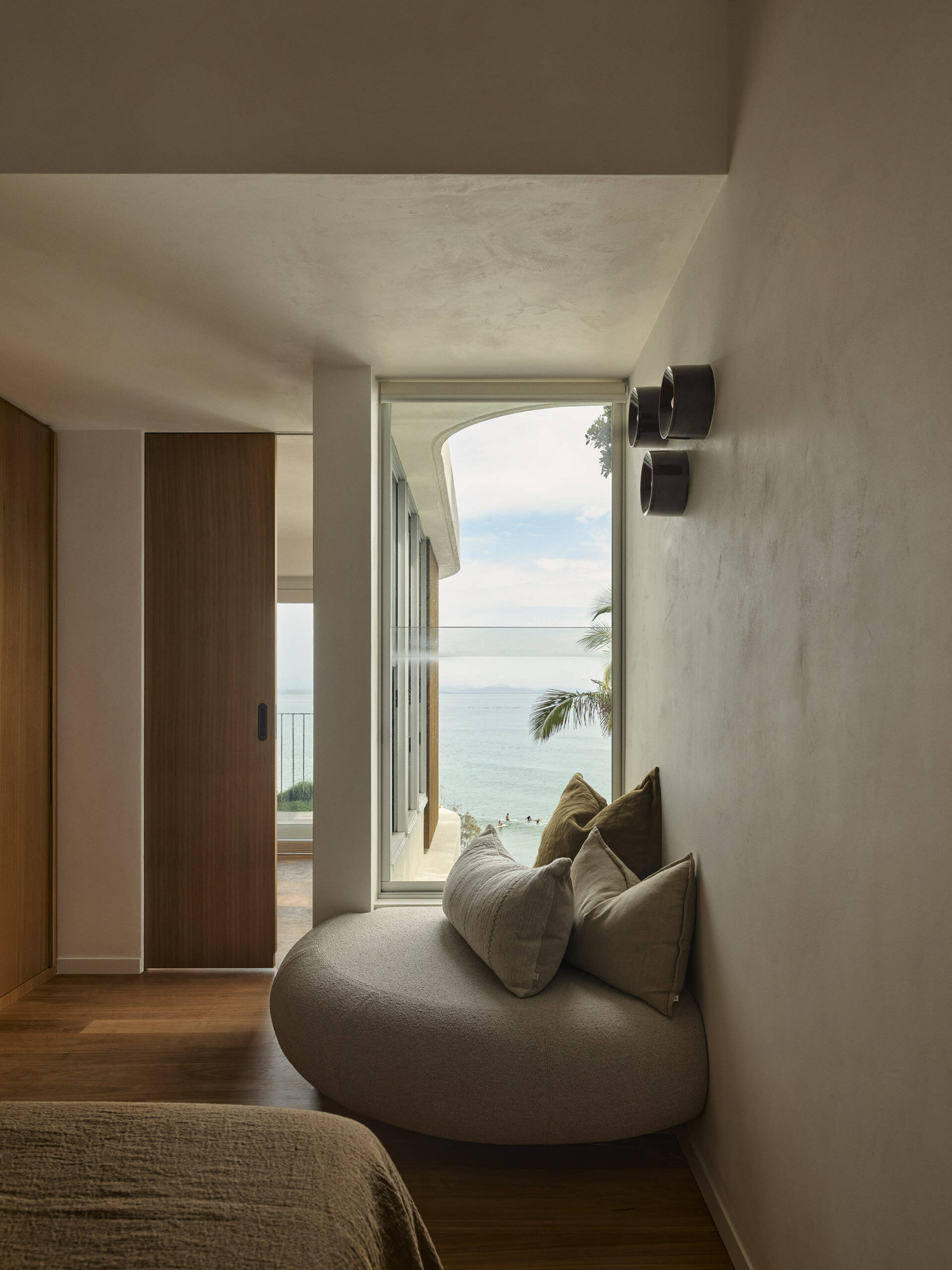 Discover the second guest bedroom in this five-level Byron Bay home, where warm timber, natural finishes and a relaxed palette create a comfortable space for family and guests.