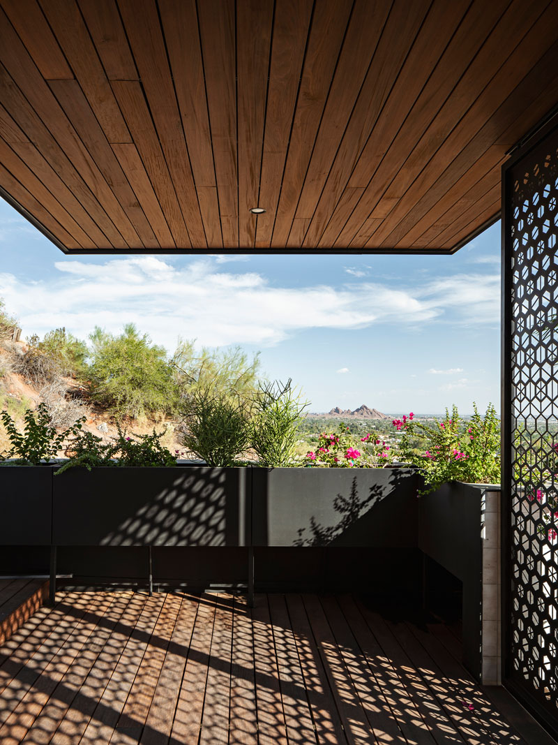 A walking deck with custom planters overlooks the driveway at the Red Rocks residence.