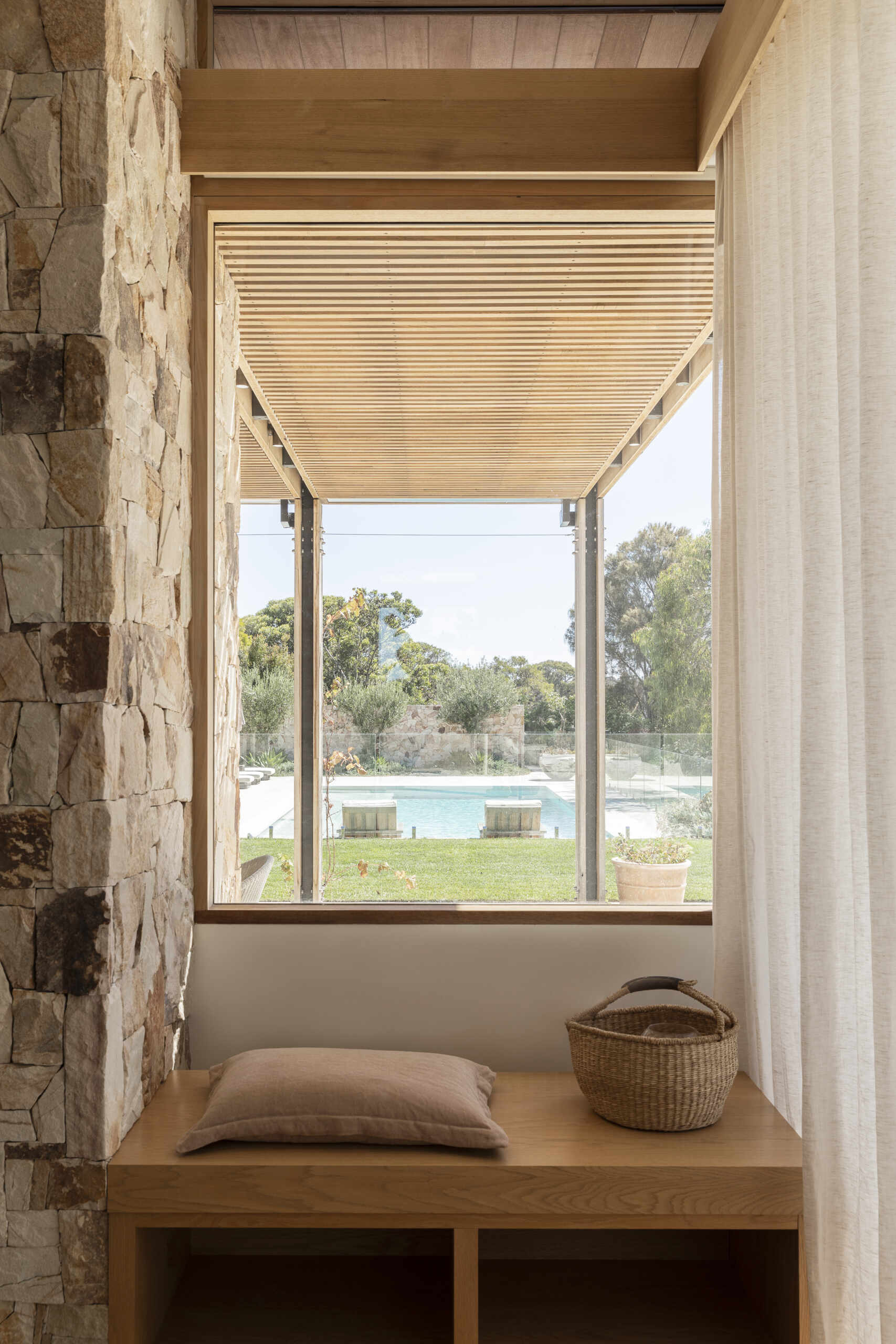 The bench underneath the window adds another place for someone to relax within this open arrangement.