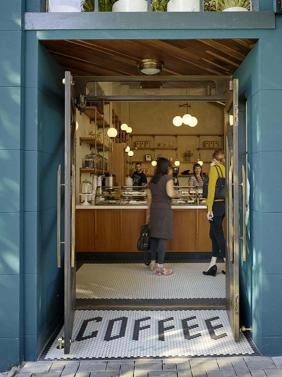 A bold blue exterior, subtle architectural details, and a welcoming entrance give Sightglass Coffee an identity that's easy to spot on a San Francisco street.