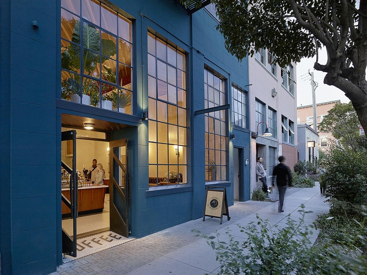 A bold blue exterior, subtle architectural details, and a welcoming entrance give Sightglass Coffee an identity that's easy to spot on a San Francisco street.