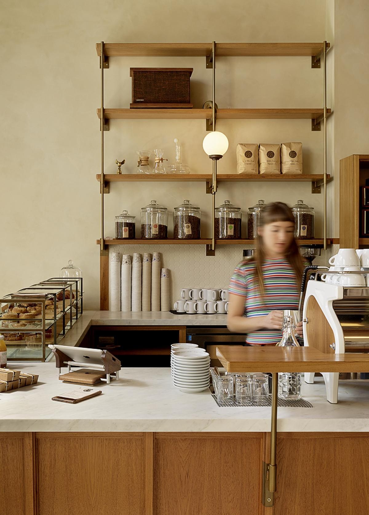 Explore the custom espresso bars, Calacatta Oro stone countertops, and brass pastry display that make the service area a standout feature.