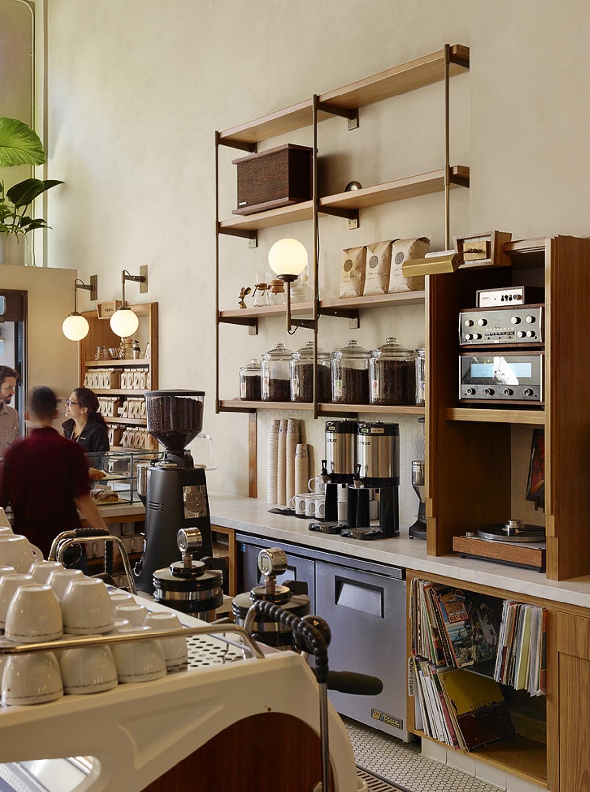 From brass hardware and handcrafted fixtures to custom woodwork and patterned tiles, every detail adds another layer to the café's design.