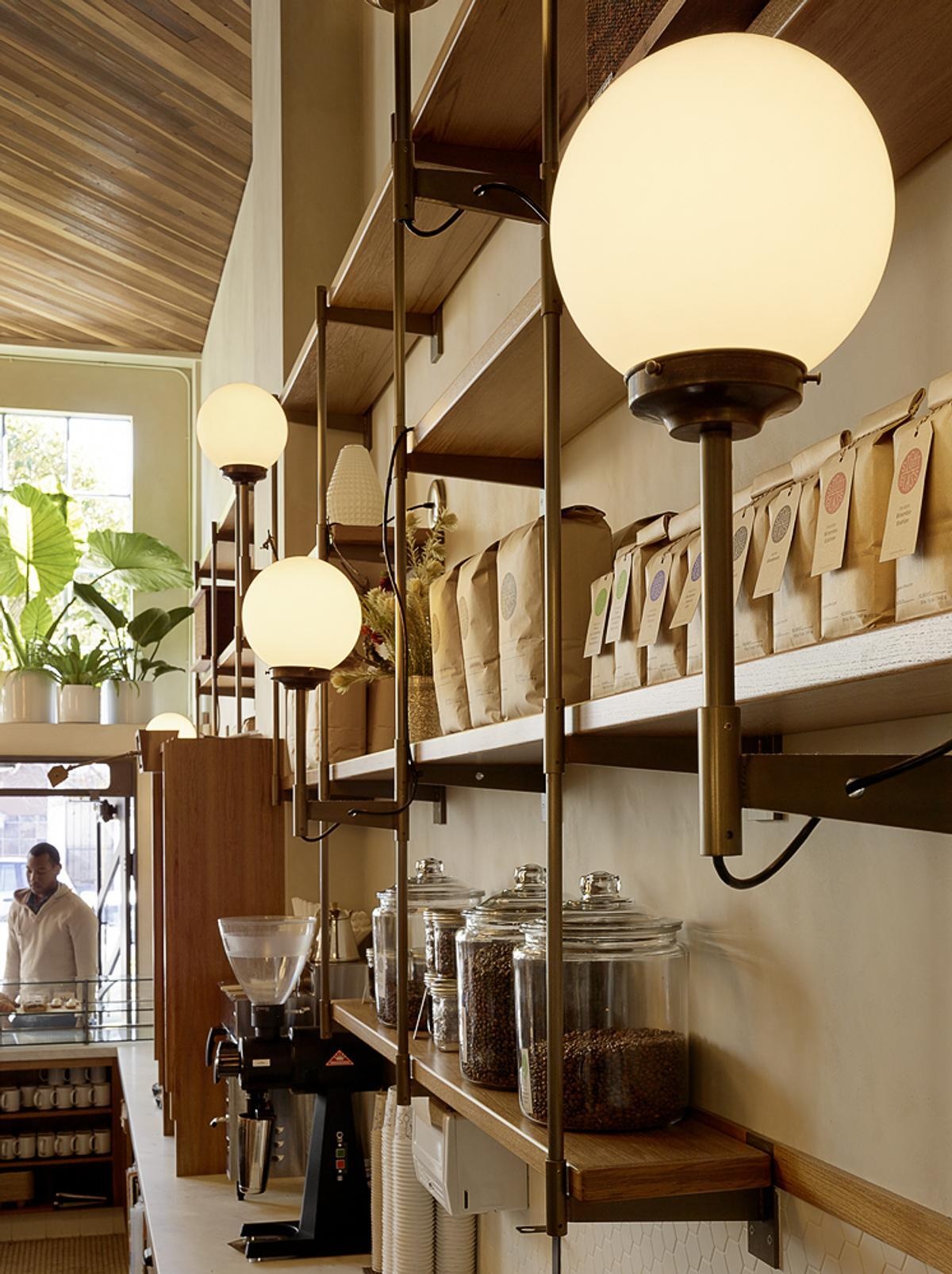 From brass hardware and handcrafted fixtures to custom woodwork and patterned tiles, every detail adds another layer to the café's design.