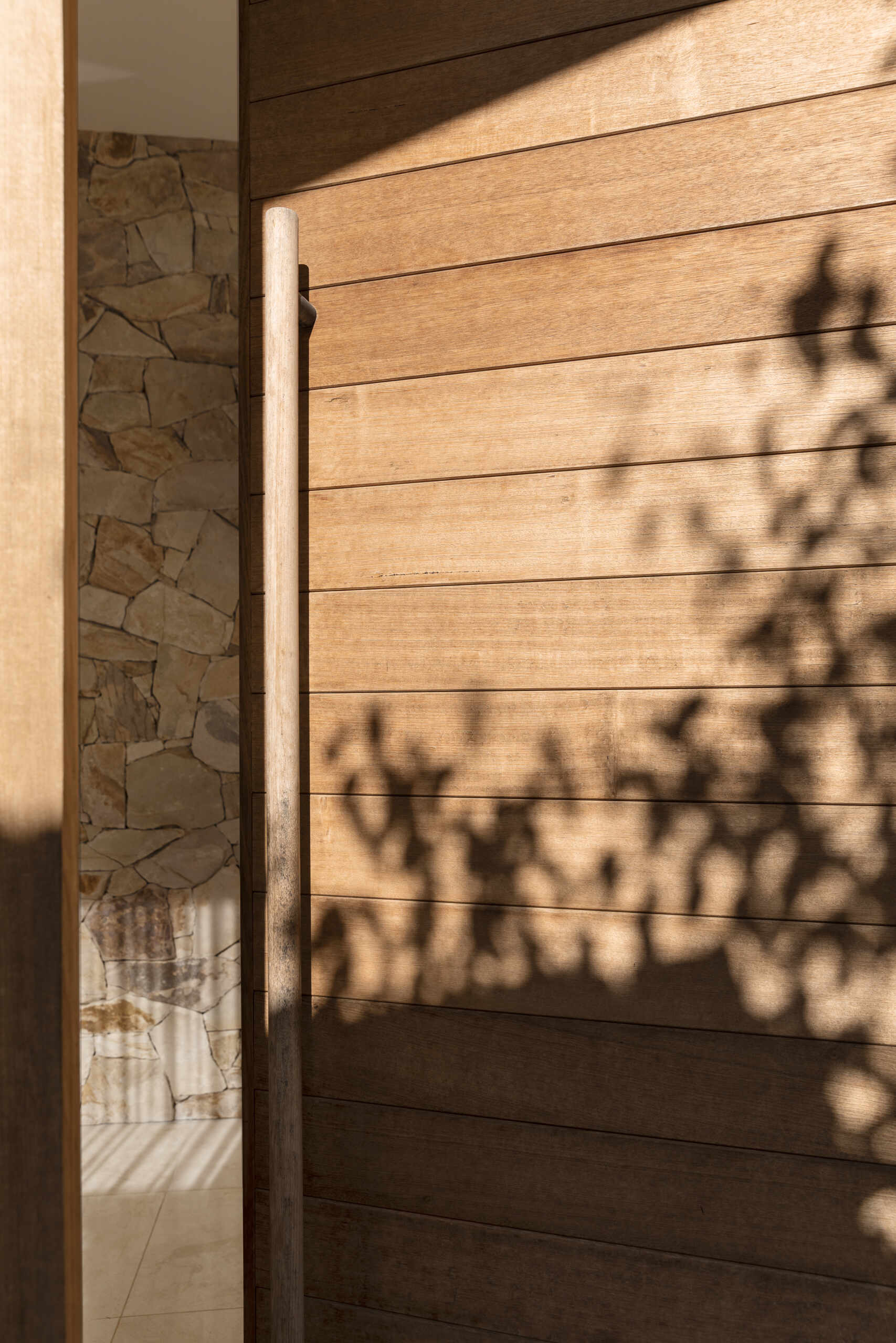 Step inside Smoke Bush House and explore an entry experience shaped by natural materials, soft light and visual connections with the landscape surrounding the property.