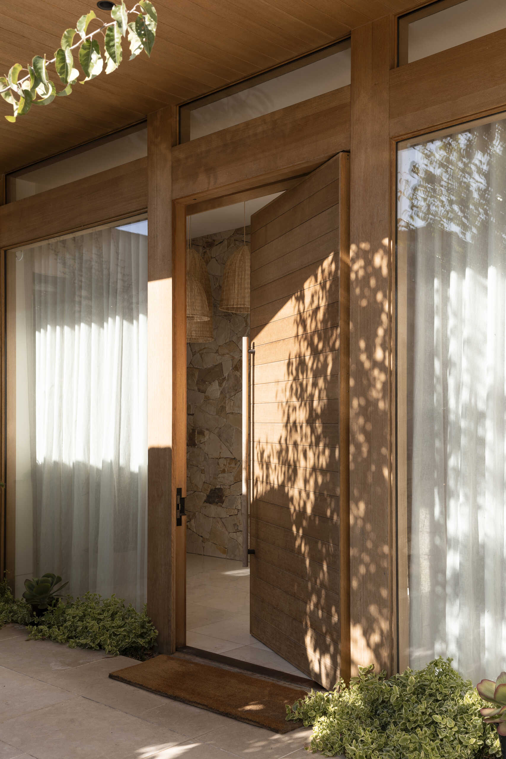 Step inside Smoke Bush House and explore an entry experience shaped by natural materials, soft light and visual connections with the landscape surrounding the property.