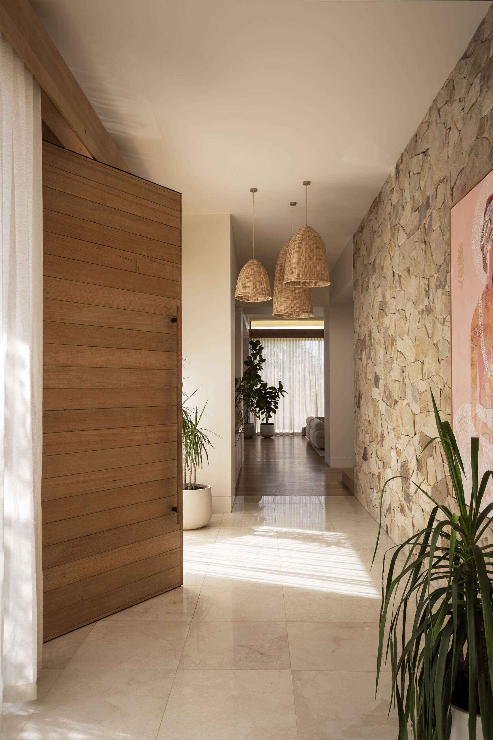 Step inside Smoke Bush House and explore an entry experience shaped by natural materials, soft light and visual connections with the landscape surrounding the property.