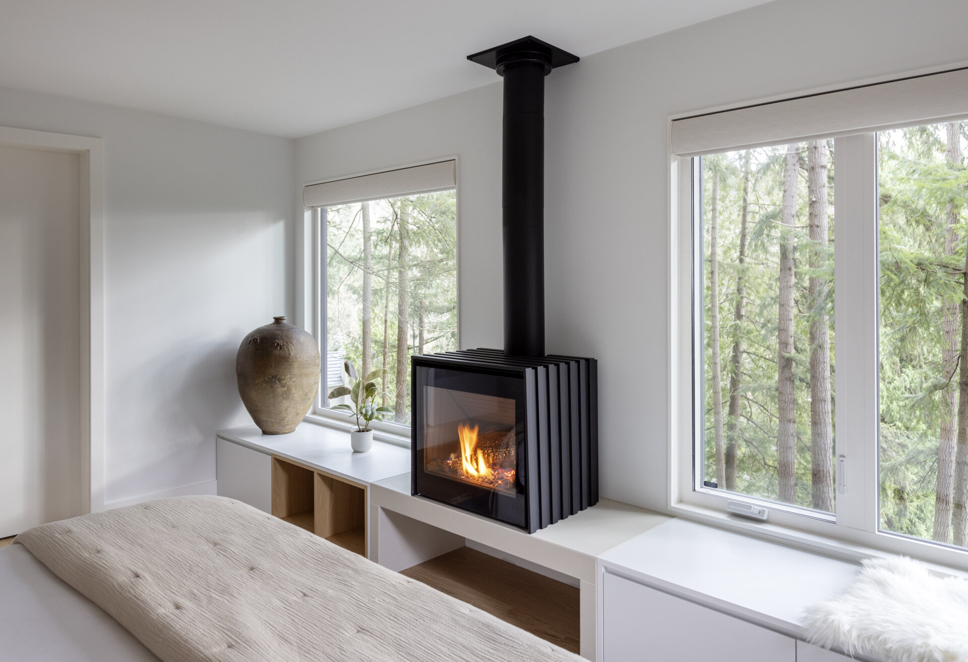 Explore the private guest suite at Westport Place House, complete with a new bathroom, forest views, earthy finishes and a wood-burning fireplace for extra warmth and comfort.