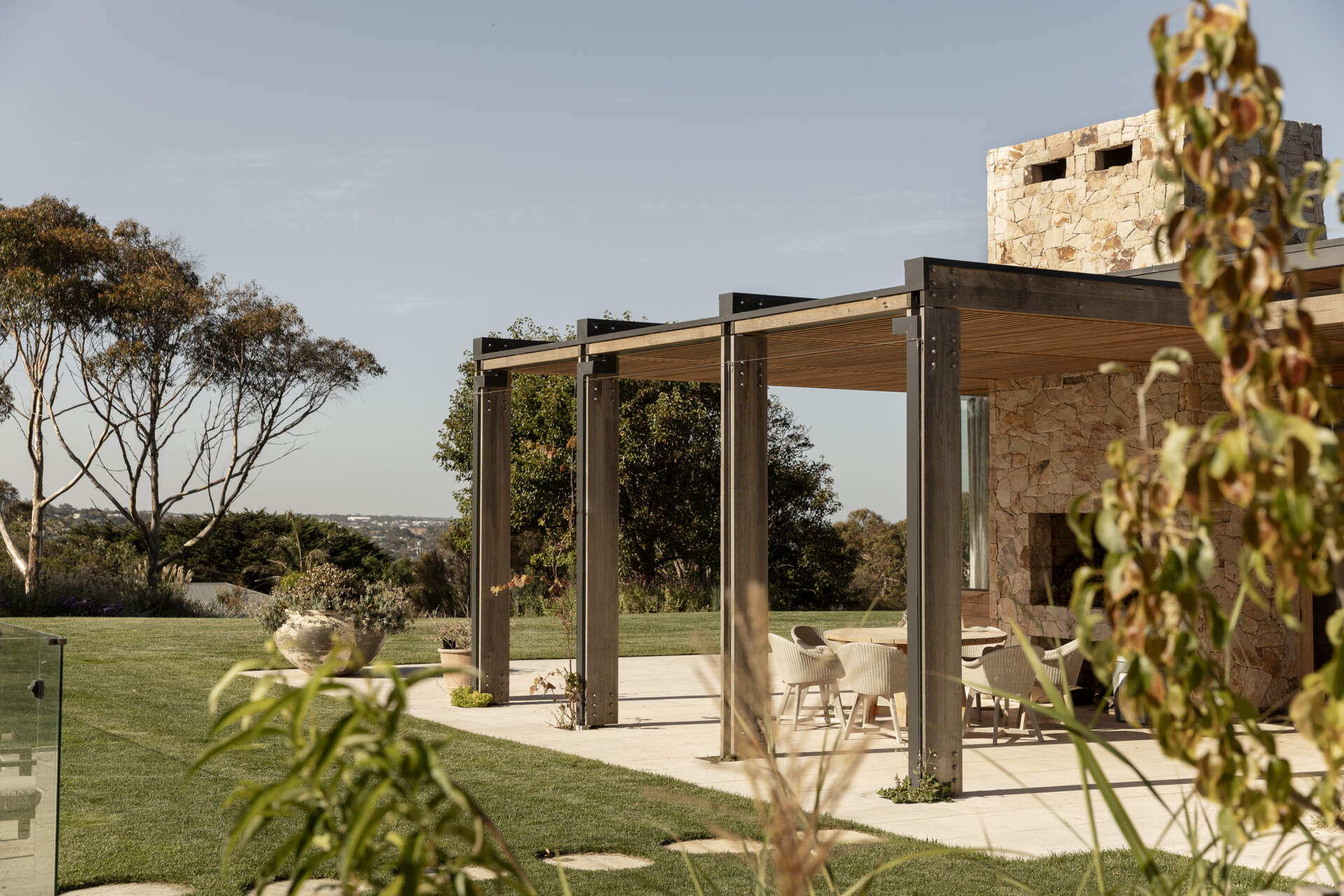 Discover the outdoor spaces at Smoke Bush House, where sheltered pavilions, a pool, patio, deck and outdoor shower extend the home into its surrounding landscape.