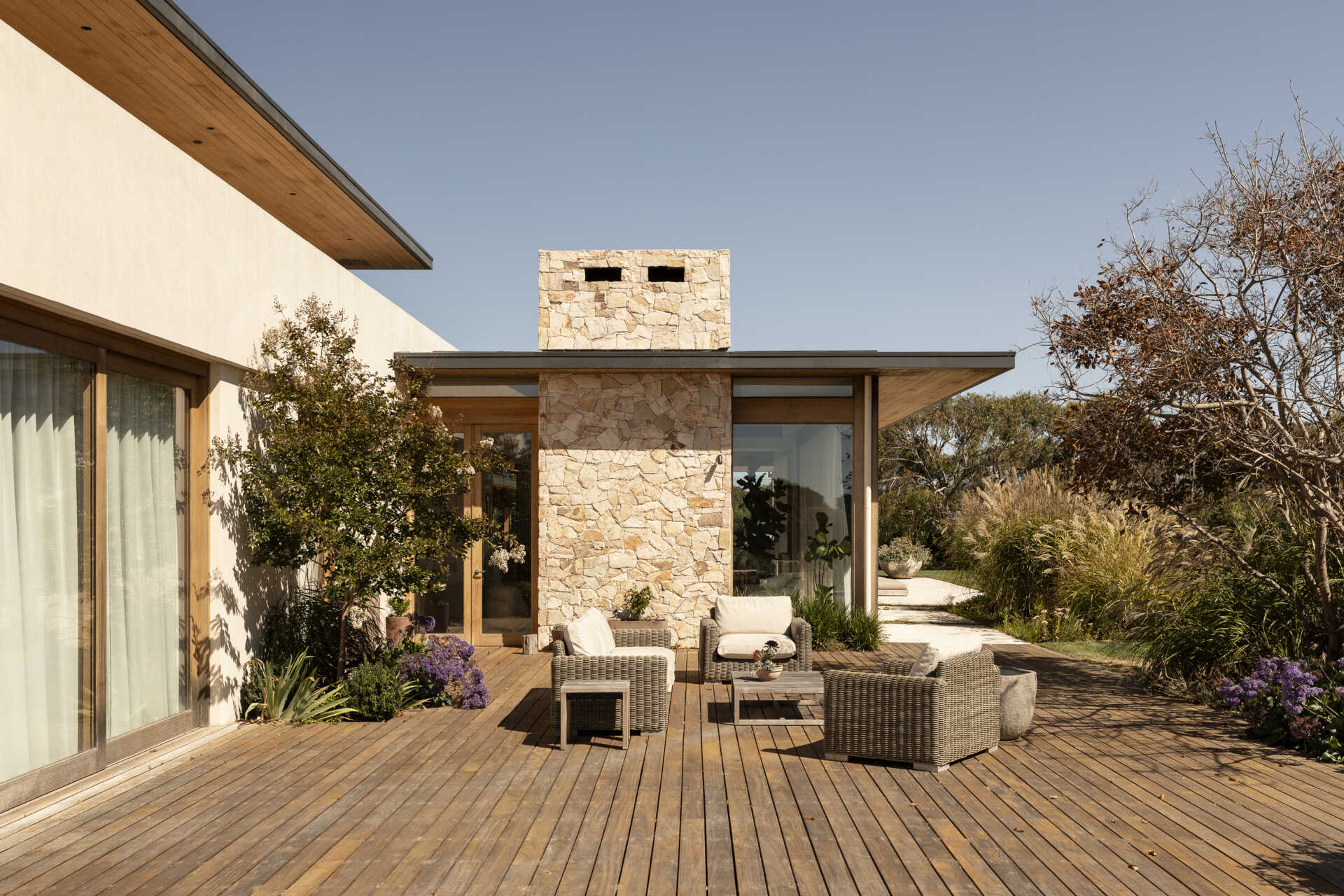 Discover the outdoor spaces at Smoke Bush House, where sheltered pavilions, a pool, patio, deck and outdoor shower extend the home into its surrounding landscape.