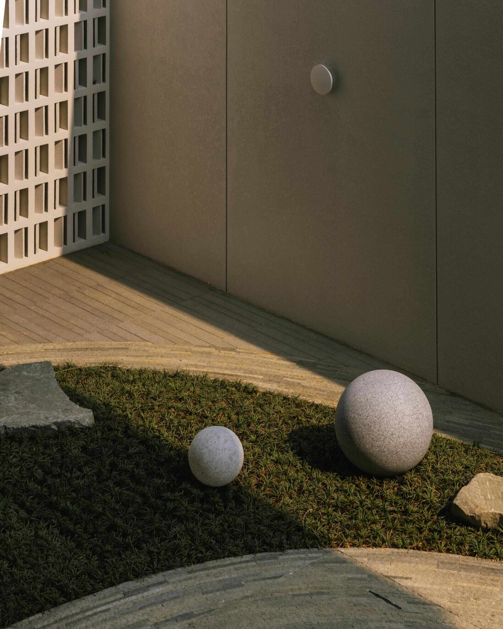 The ground floor of Split Mass Residence combines an office, meeting room, service areas and a garden arcade, creating a separate working zone within the family home.