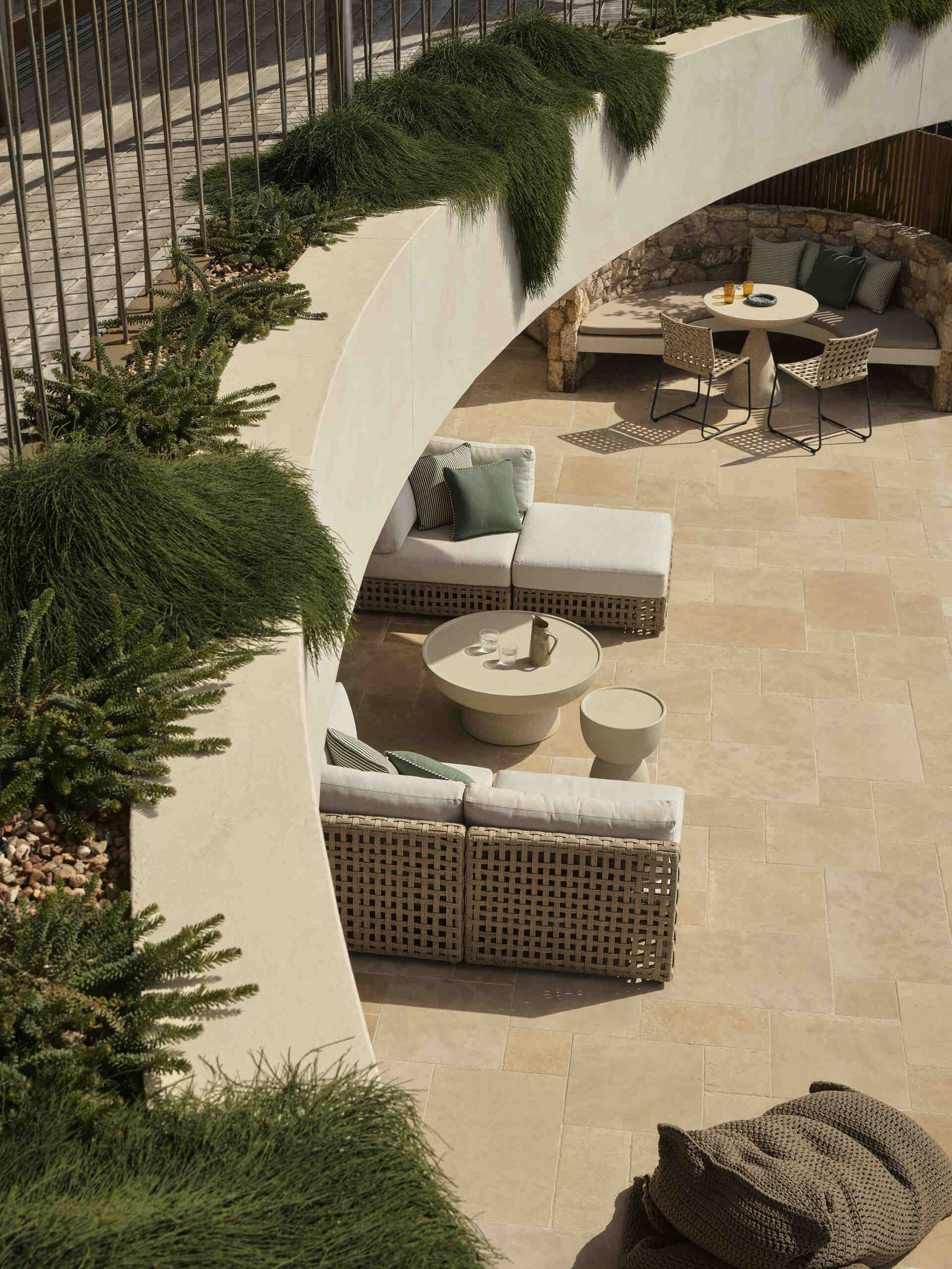 Take a look at the expansive outdoor terrace of this Wategos Beach home, where the main living spaces open directly outdoors and elevated gardens soften the multi-level architecture.
