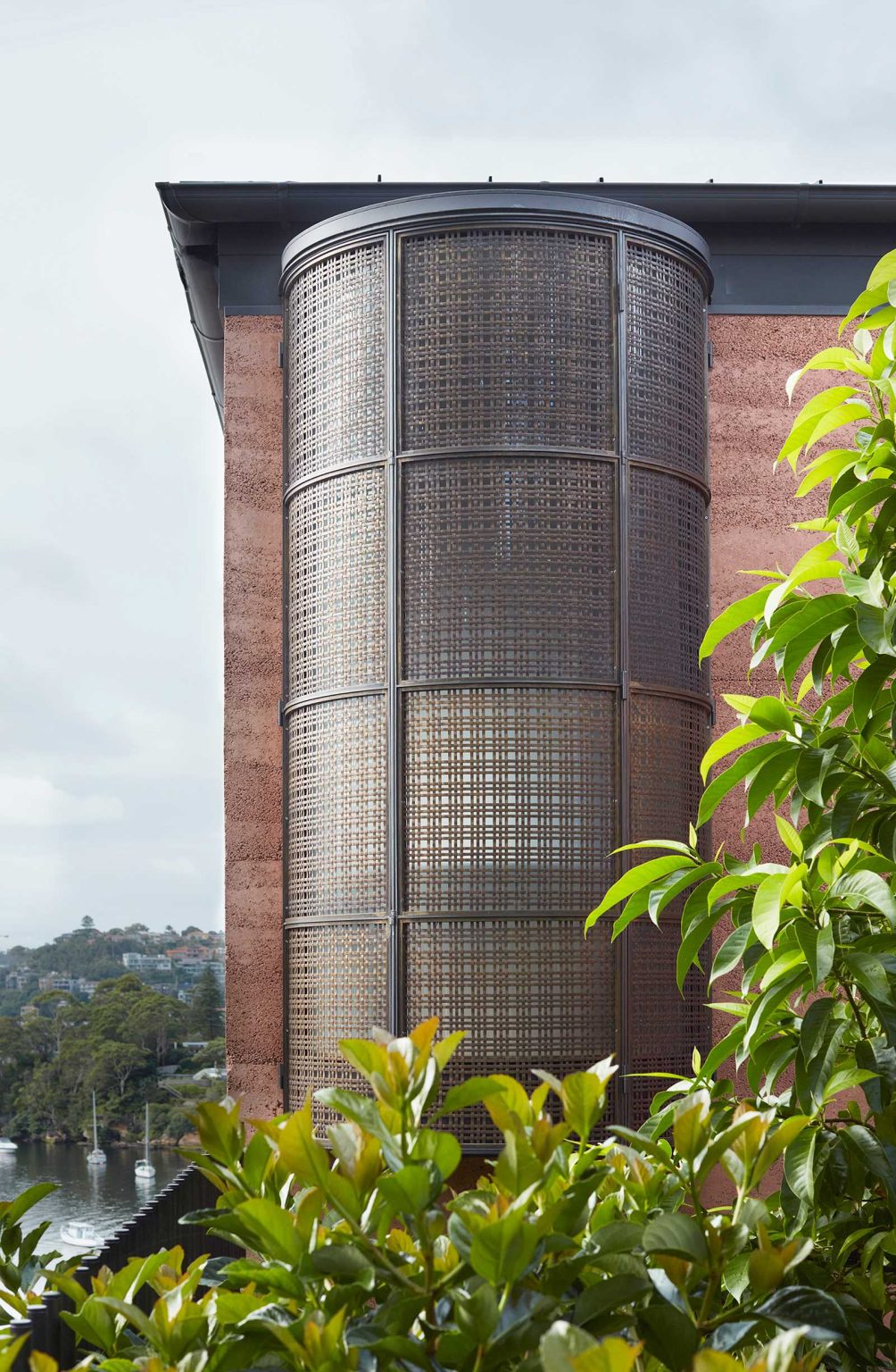 Warm rammed earth walls welcome visitors into Earth-Ship, a renovated Sydney home by Luigi Rosselli Architects. Discover the earthy entrance, landscaped courtyard and architectural details of this unusual Australian house.