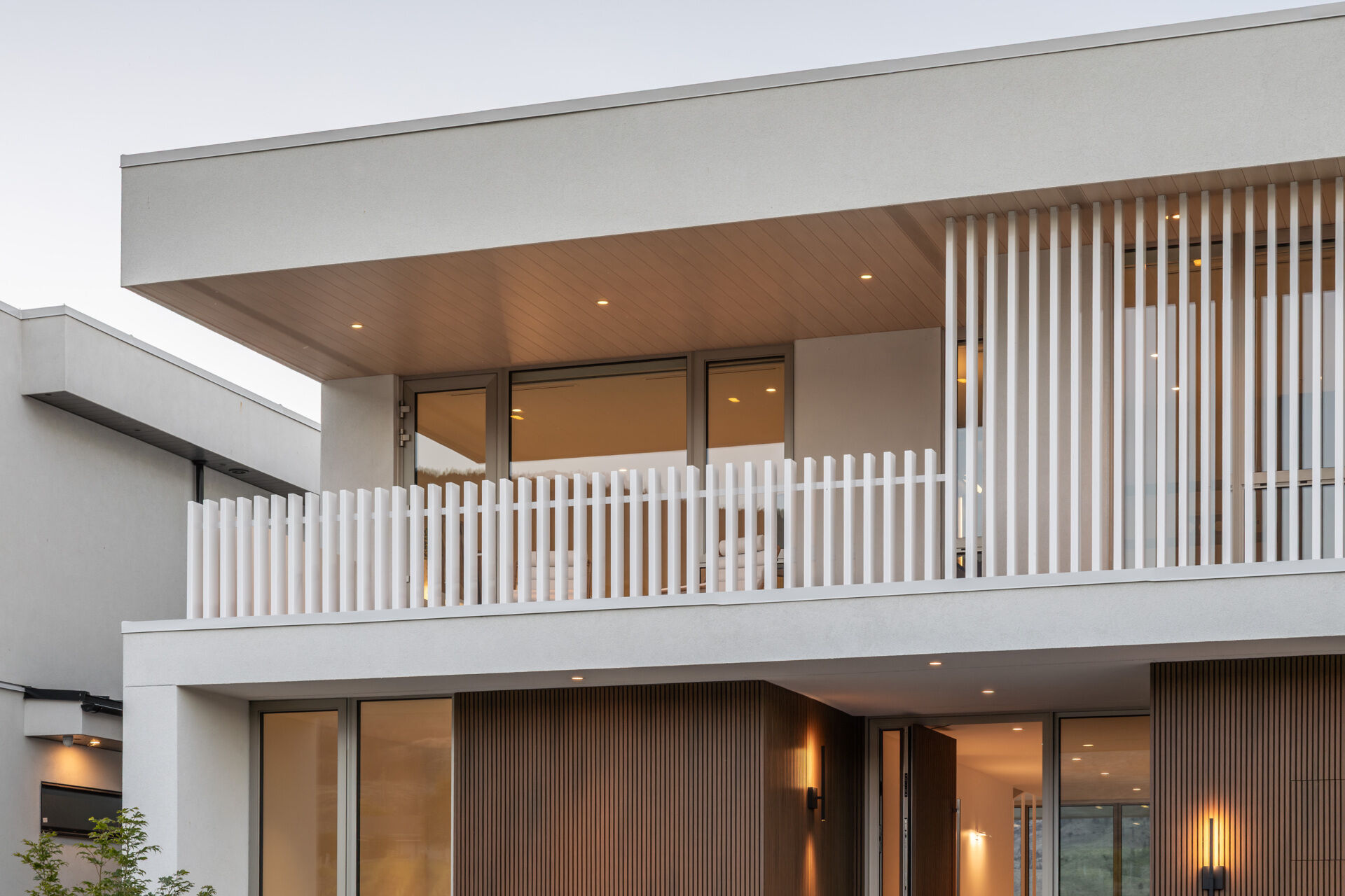 Desert Lake House by BLA Design Group sits on the shores of Osoyoos Lake, using layered volumes, sheltered spaces and lake views to shape its interiors.