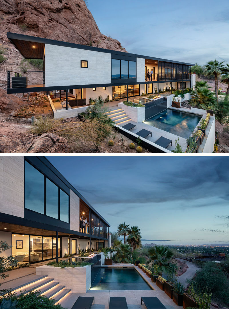 Hidden lighting guides the stairs down toward the pool at this Camelback Mountain residence, where planters line the outdoor space and connect the different levels of the steep site.