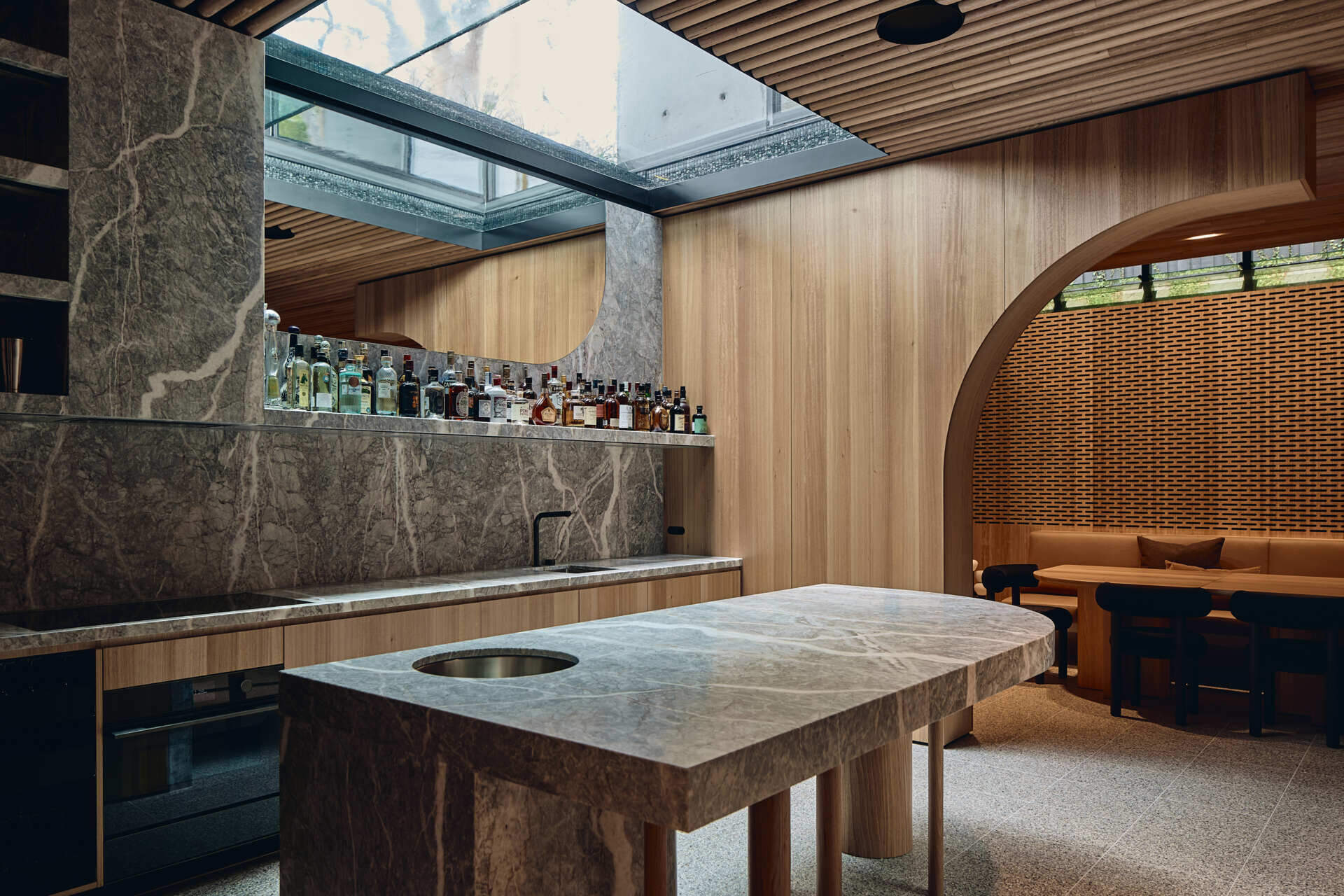 Below the garden, Babylonia's entertaining level includes a kitchen, bar, dining area and relaxed lounge