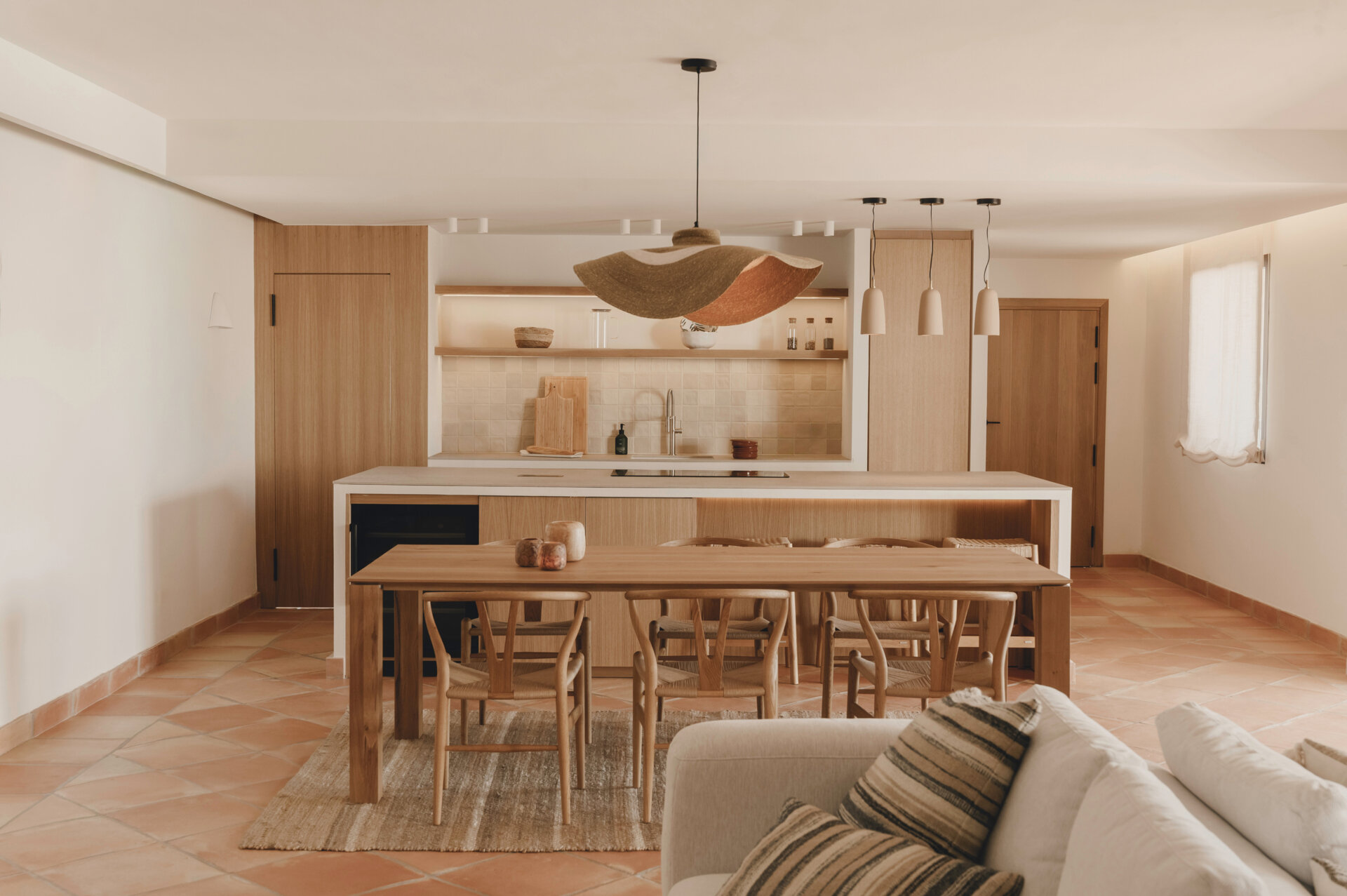 This Mediterranean kitchen pairs custom oak cabinetry with a handcrafted dining space centred around a beautiful solid oak table.
