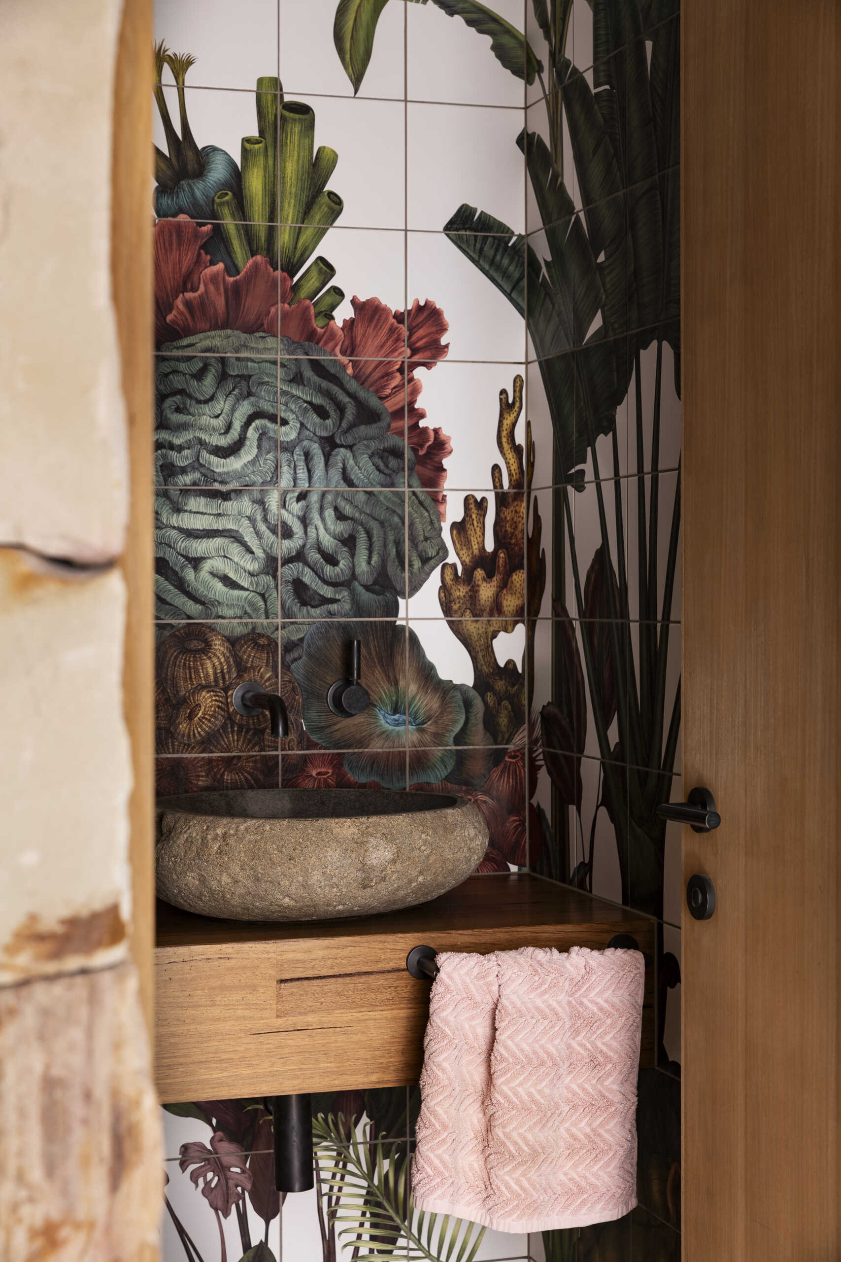See the extraordinary powder room at Smoke Bush House, featuring bespoke artwork by Karina Eibatova that covers all four walls with an immersive composition of flora and fauna.