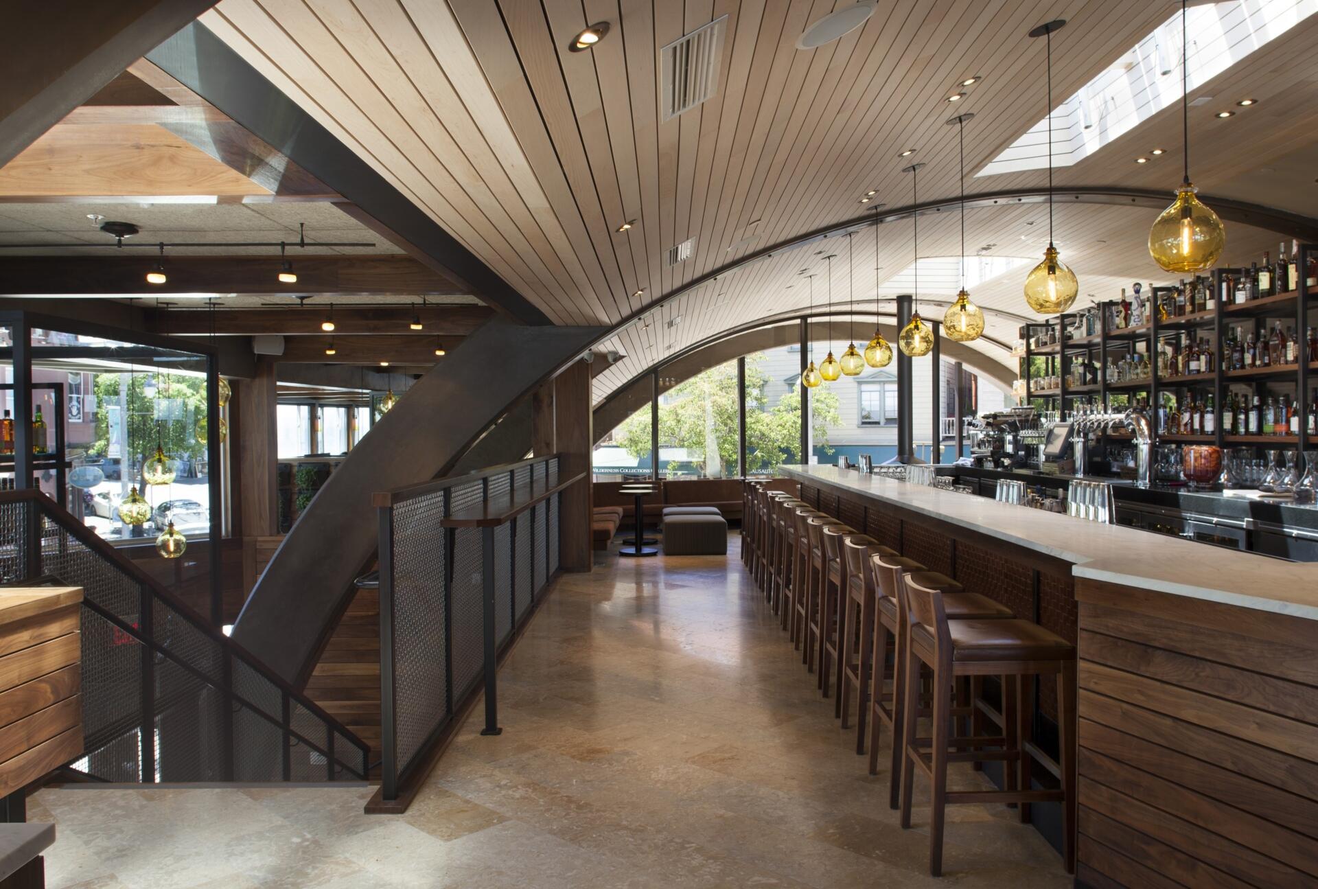 See how a former Sausalito ferry terminal was transformed into Barrel House Tavern while retaining historic features including expansive windows, cement plaster arches, and a reclaimed maple ceiling.