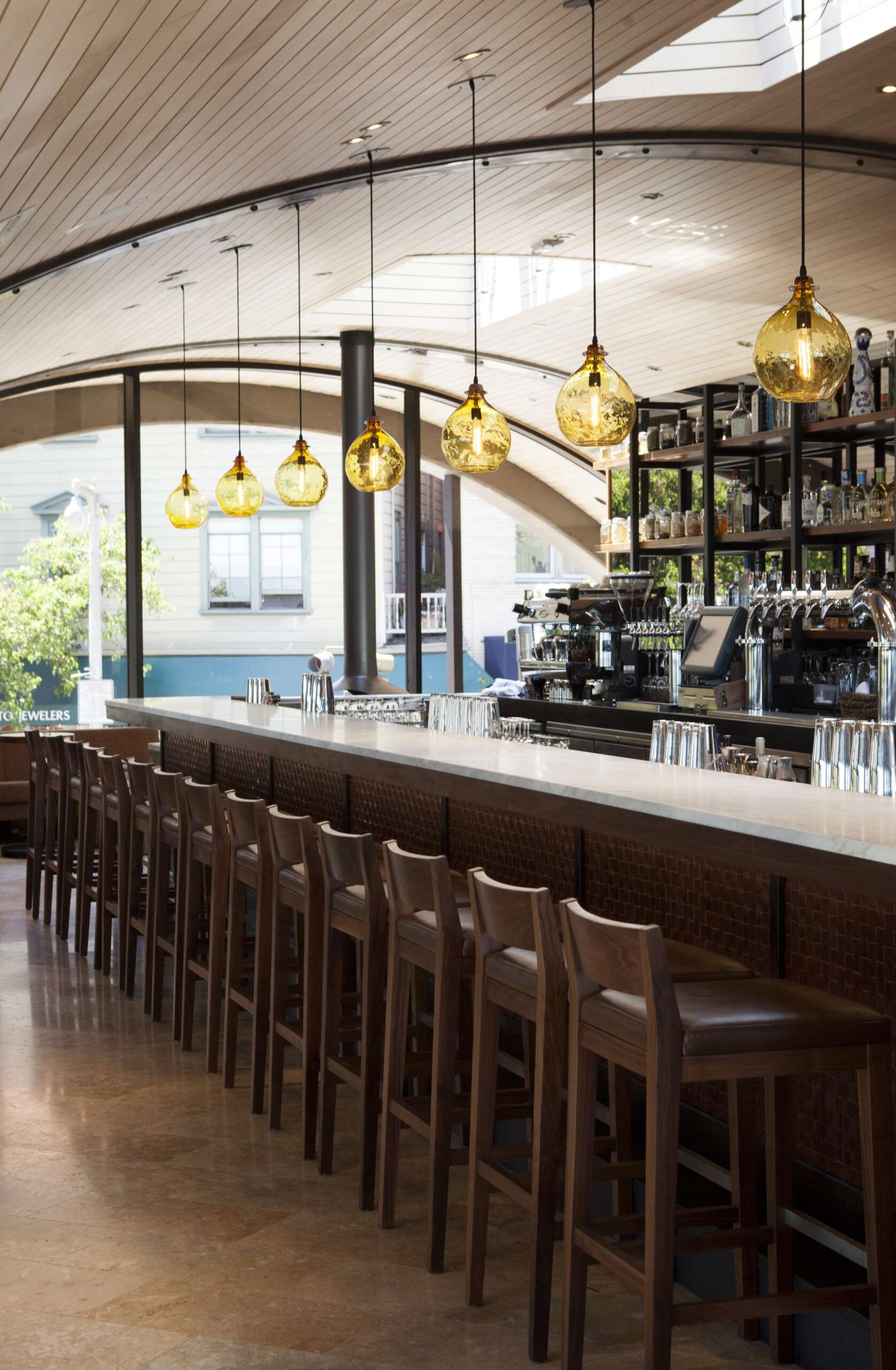 See how a former Sausalito ferry terminal was transformed into Barrel House Tavern while retaining historic features including expansive windows, cement plaster arches, and a reclaimed maple ceiling.