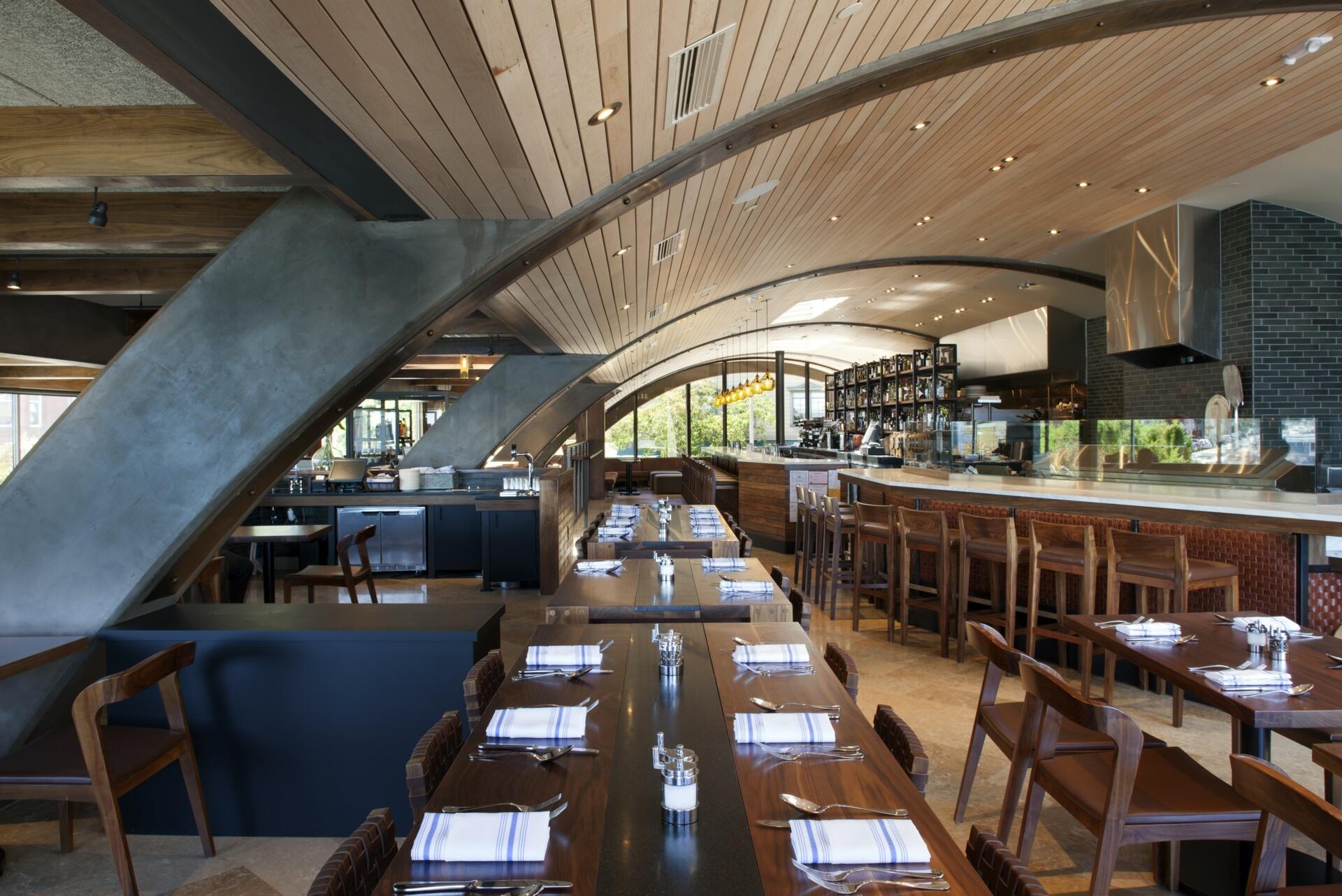 See how a former Sausalito ferry terminal was transformed into Barrel House Tavern while retaining historic features including expansive windows, cement plaster arches, and a reclaimed maple ceiling.