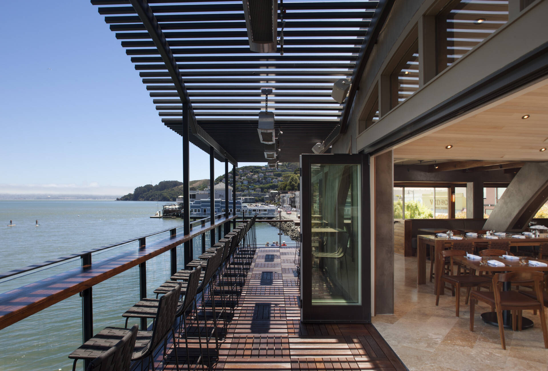 See how a former Sausalito ferry terminal was transformed into Barrel House Tavern while retaining historic features including expansive windows, cement plaster arches, and a reclaimed maple ceiling.