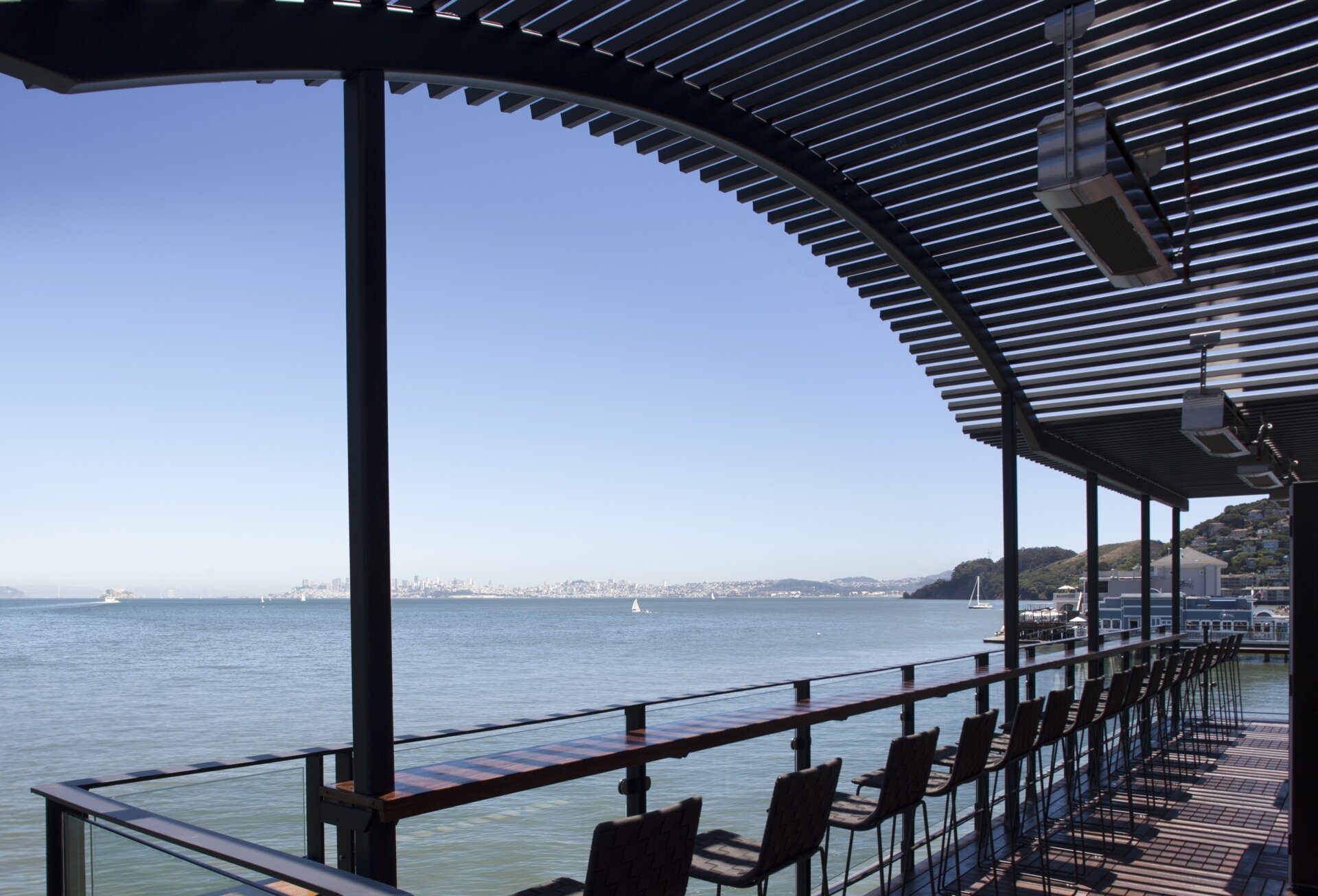 See how a former Sausalito ferry terminal was transformed into Barrel House Tavern while retaining historic features including expansive windows, cement plaster arches, and a reclaimed maple ceiling.