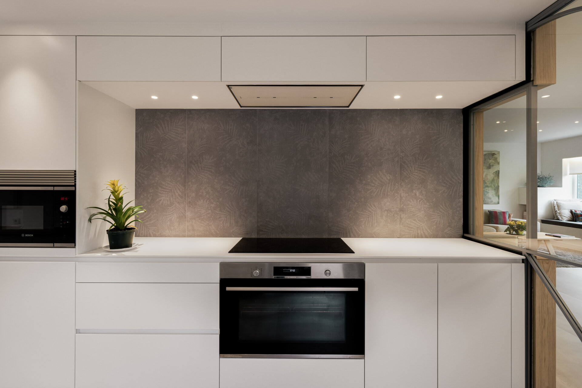 See how the kitchen sits between two dining areas in D + A House, forming the central link within a new open ground-floor layout.