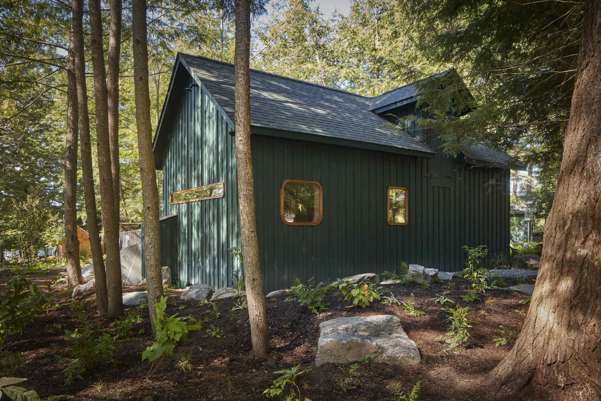 PARTISANS transformed a modest ice-storage hut on a Muskoka island into a compact thermal spa filled with carved Canadian Shield granite, custom-milled cedar, a sauna, cold plunge and steam room, as well as an outdoor patio with outdoor shower.