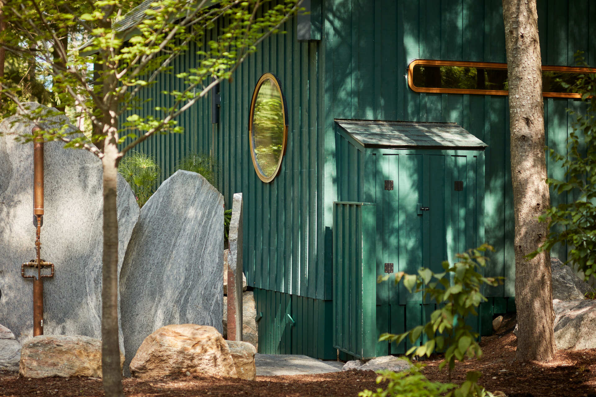 PARTISANS transformed a modest ice-storage hut on a Muskoka island into a compact thermal spa filled with carved Canadian Shield granite, custom-milled cedar, a sauna, cold plunge and steam room, as well as an outdoor patio with outdoor shower.