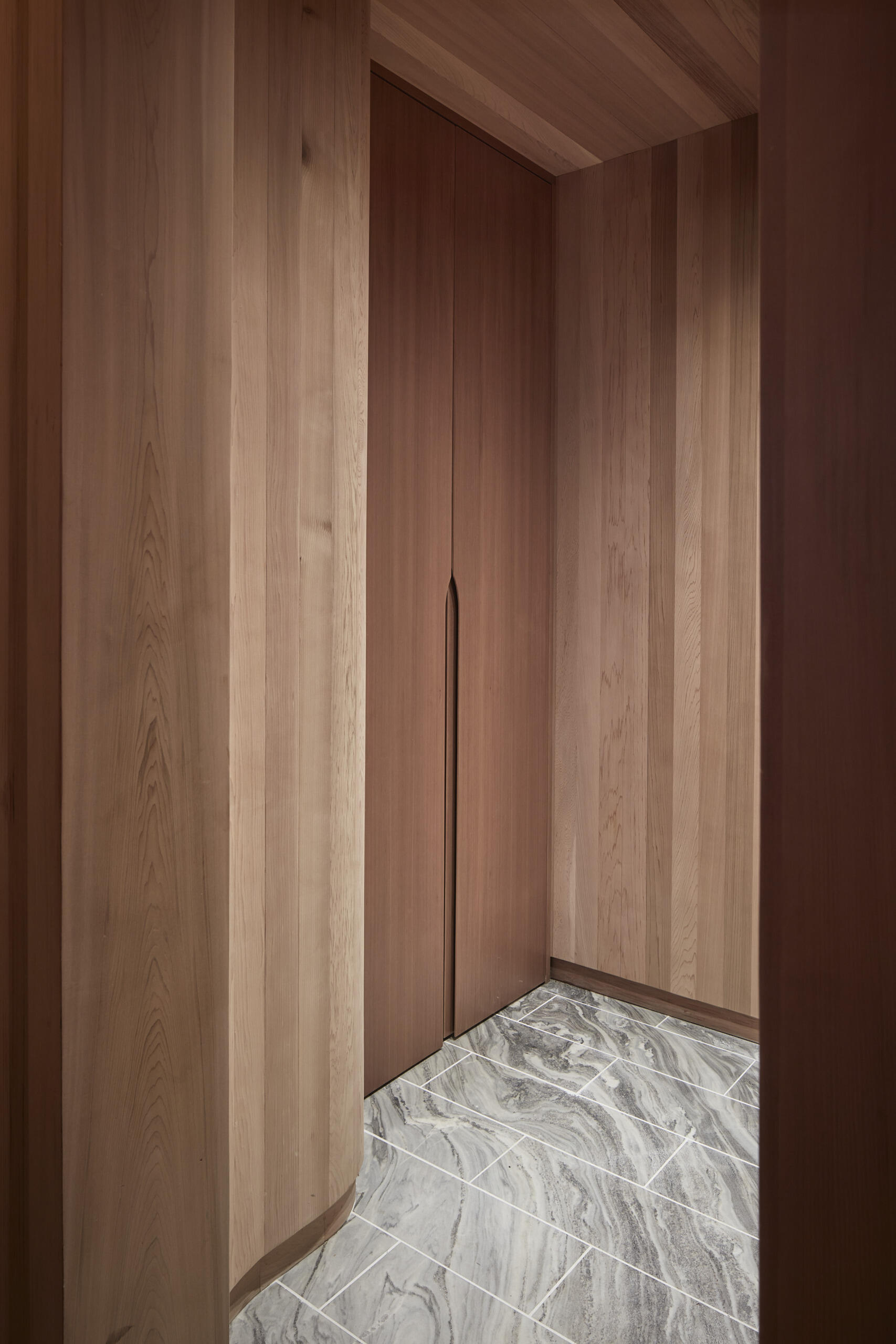 PARTISANS transformed a modest ice-storage hut on a Muskoka island into a compact thermal spa filled with carved Canadian Shield granite, custom-milled cedar, a sauna, cold plunge and steam room, as well as an outdoor patio with outdoor shower.