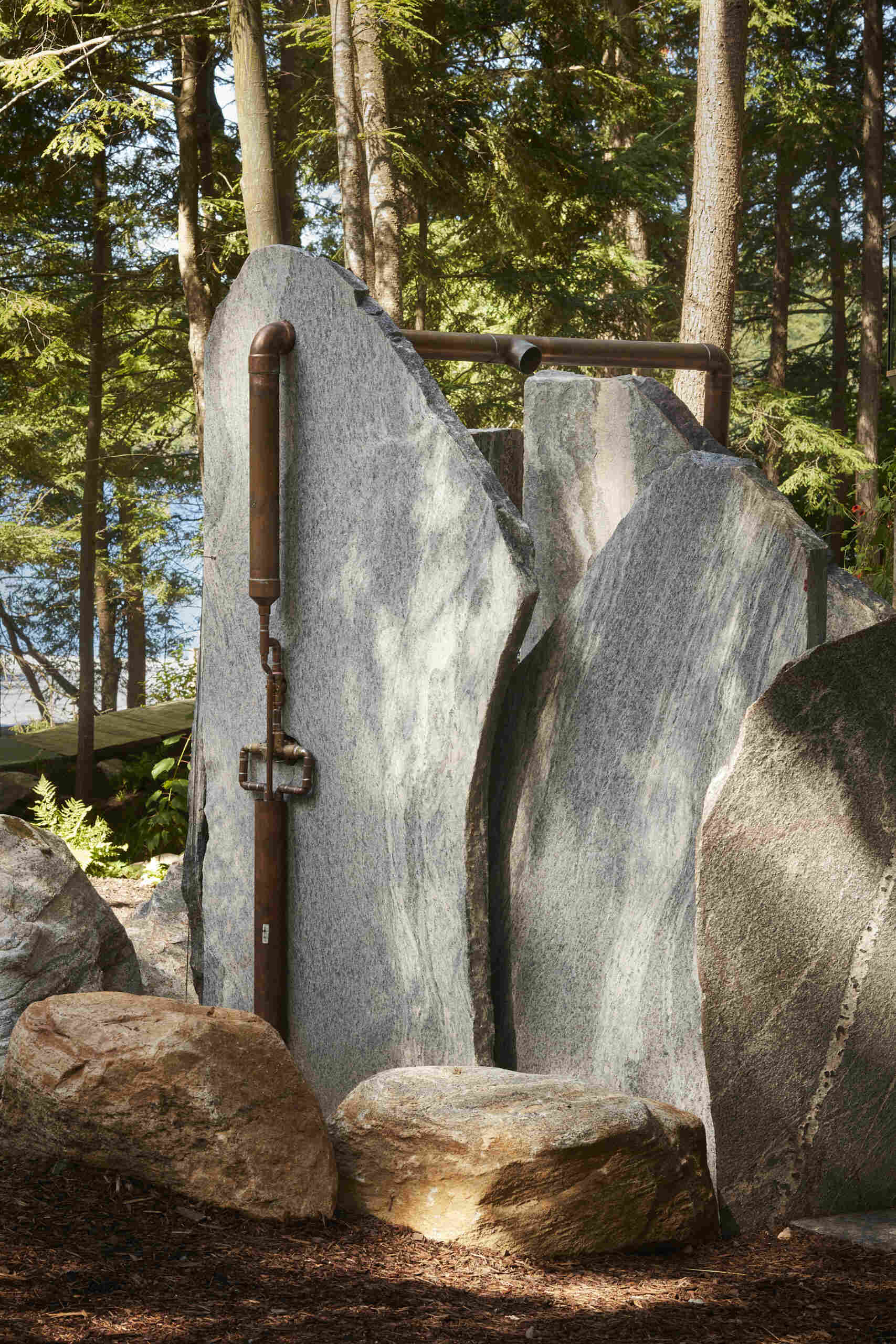 PARTISANS transformed a modest ice-storage hut on a Muskoka island into a compact thermal spa filled with carved Canadian Shield granite, custom-milled cedar, a sauna, cold plunge and steam room, as well as an outdoor patio with outdoor shower.