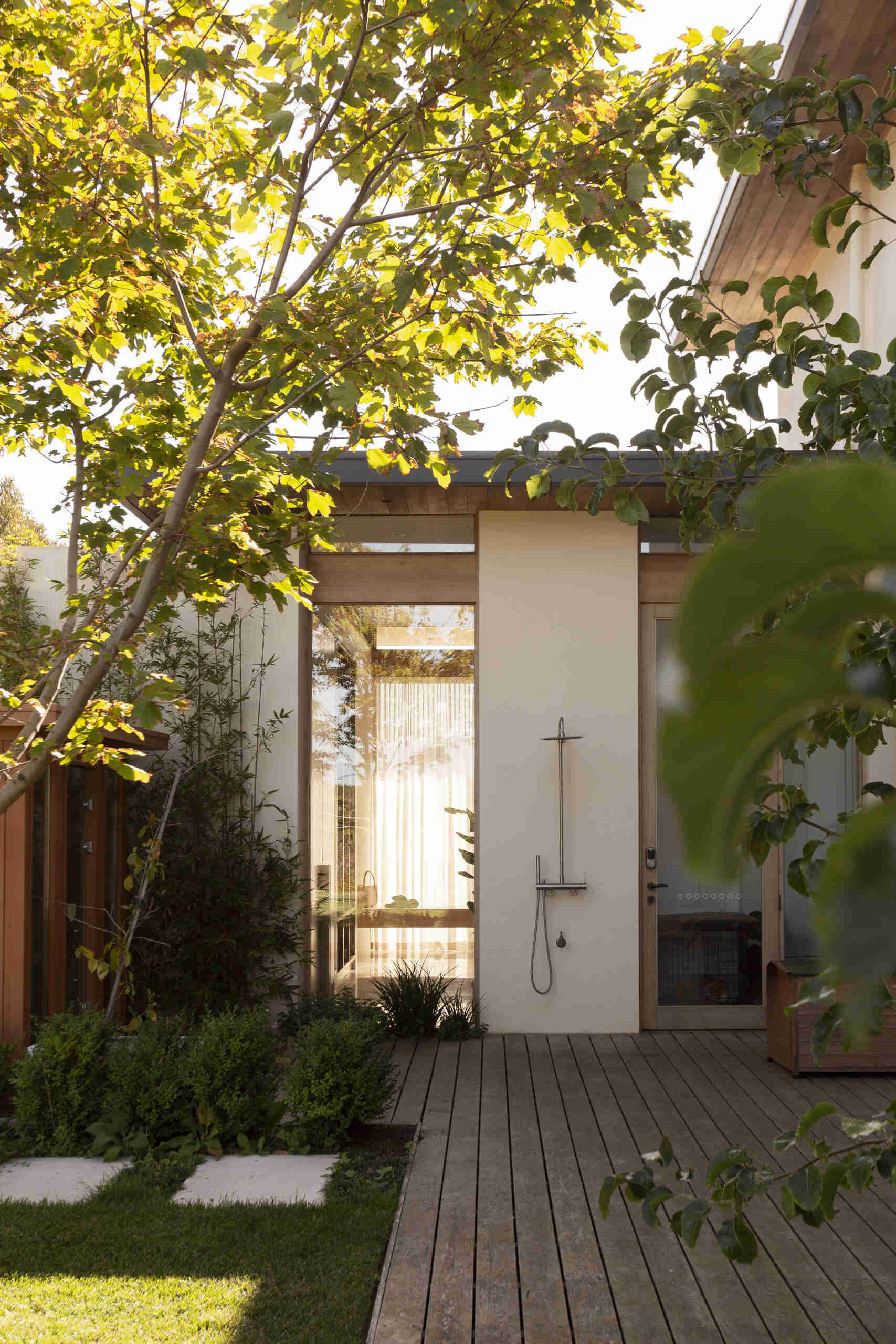 A modern home with an outdoor shower.