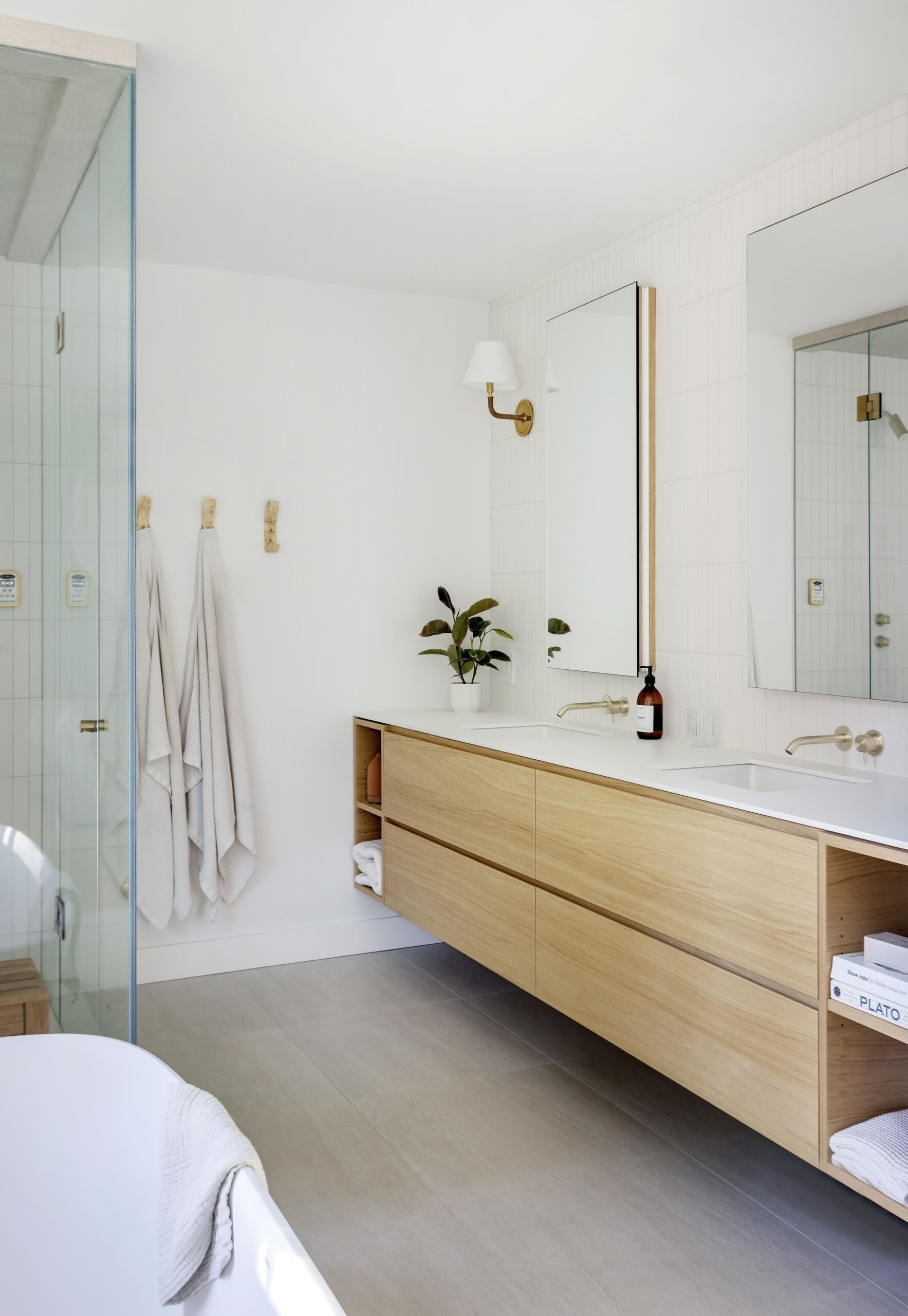 The principal bedroom and ensuite at this West Vancouver mid-century home were expanded and reconfigured, creating a quiet and comfortable part of the house surrounded by forest.