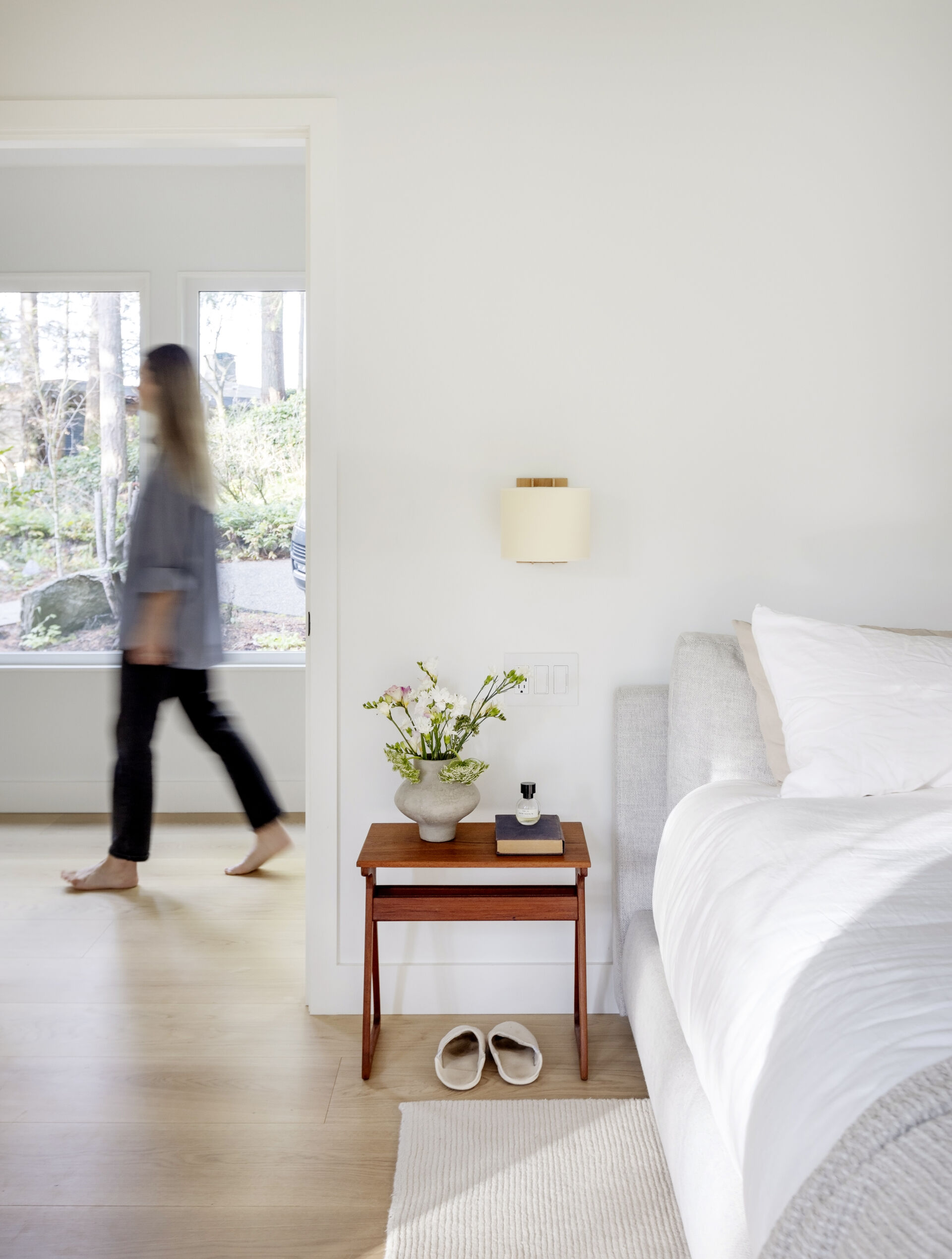 The principal bedroom and ensuite at this West Vancouver mid-century home were expanded and reconfigured, creating a quiet and comfortable part of the house surrounded by forest.