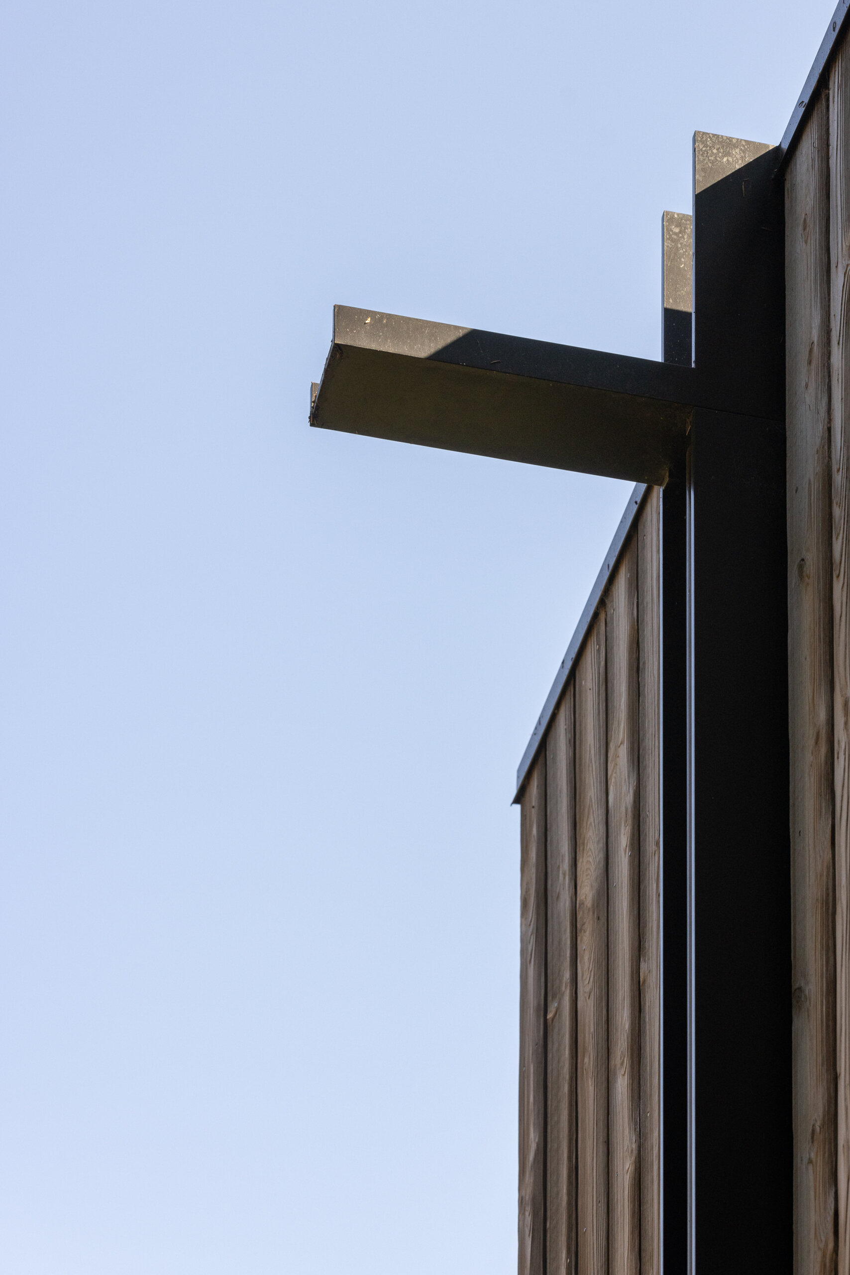 Explore the exterior details of this elevated forest cabin, from its outdoor circulation and ipe decking to Western red cedar siding and powder-coated steel elements.
