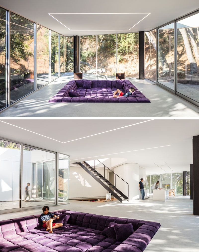 The sunken living room features 144 square feet of B&B Italia's Tufty Time sofa components, set beneath linear LED strips that define the open-plan space.