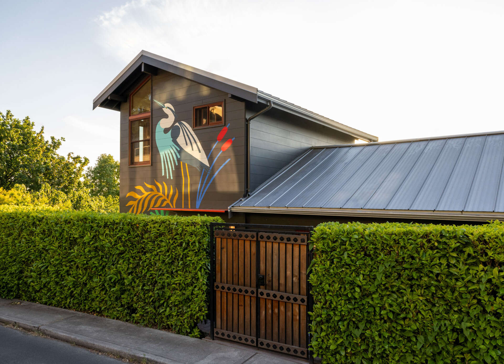 Tour Alki Lookout, a colorful 1910 home above Alki Beach in West Seattle, renovated by SHED Architecture & Design with warm timber, playful tile, clever built-ins and panoramic Puget Sound views.