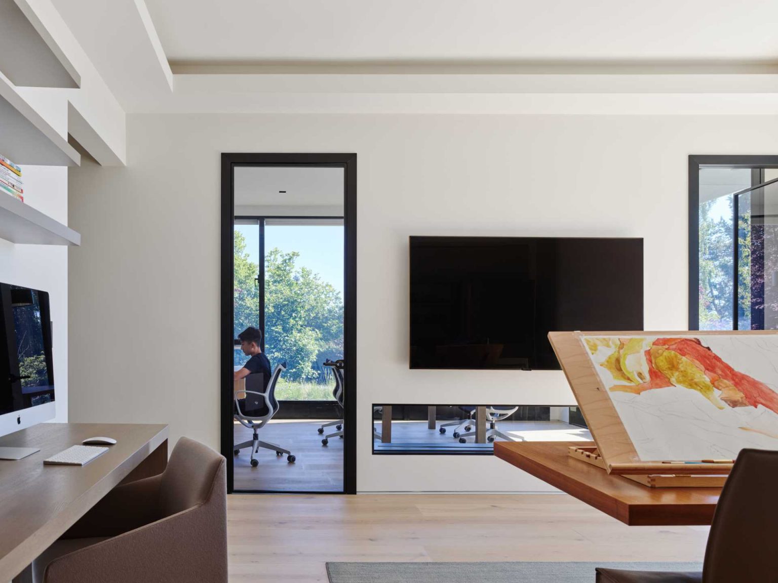 Nanton House includes a dedicated home office and art studio, adding flexible spaces for working and creative projects within the four-level family home.