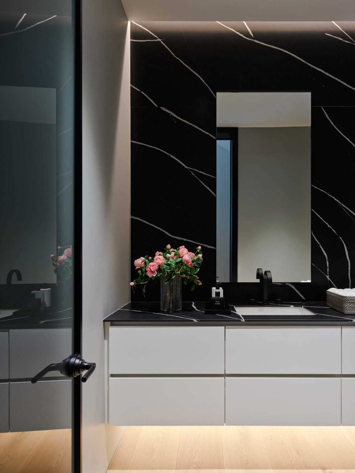 The bathrooms at Nanton House feature contemporary interiors, with some including freestanding bathtubs that add a sculptural element to the spaces.