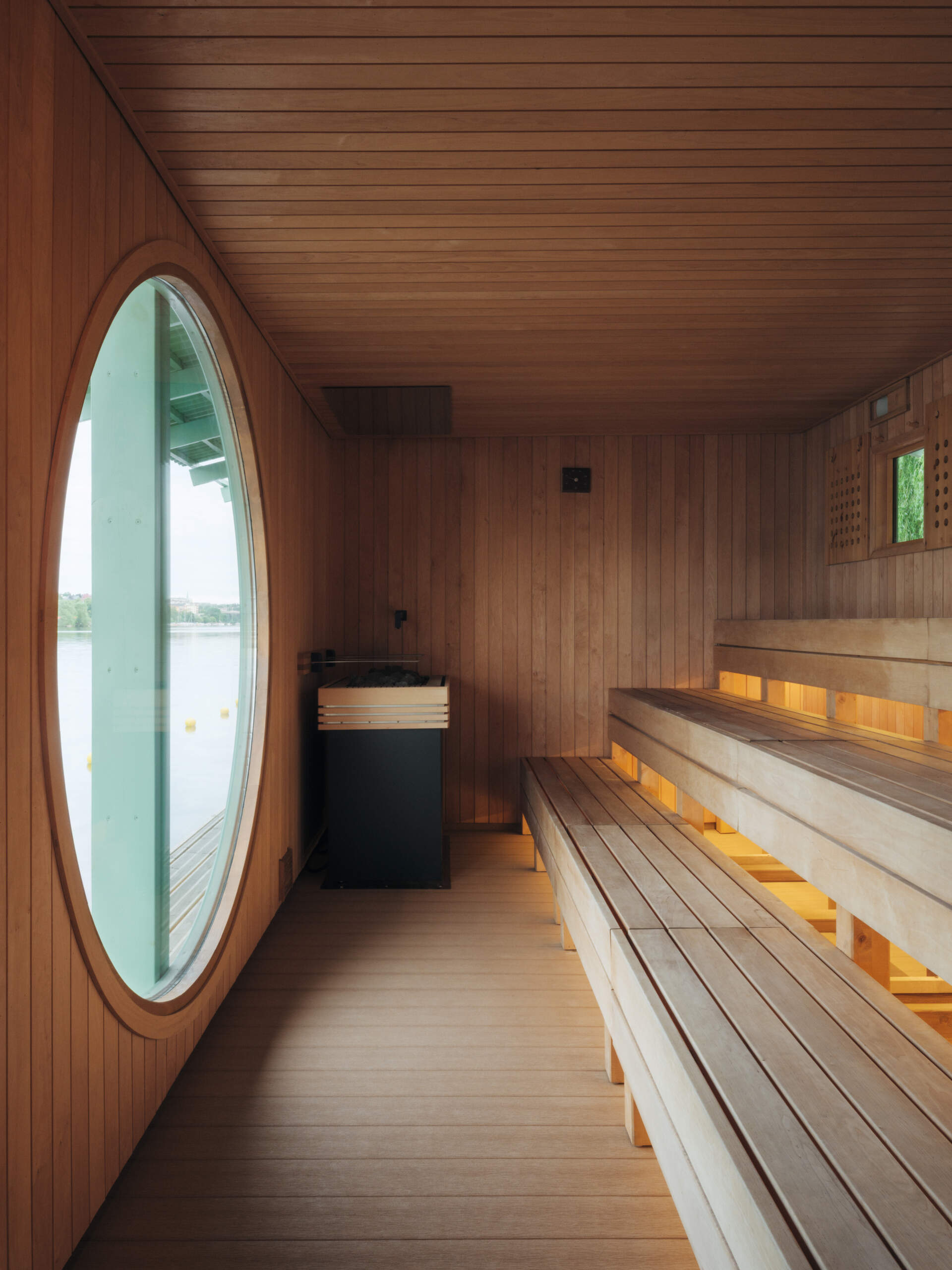 DinellJohansson’s floating sauna at Hornstull pairs a verdigris-green exterior with a public pier and pergola, creating a new waterfront gathering place for up to 16 visitors.