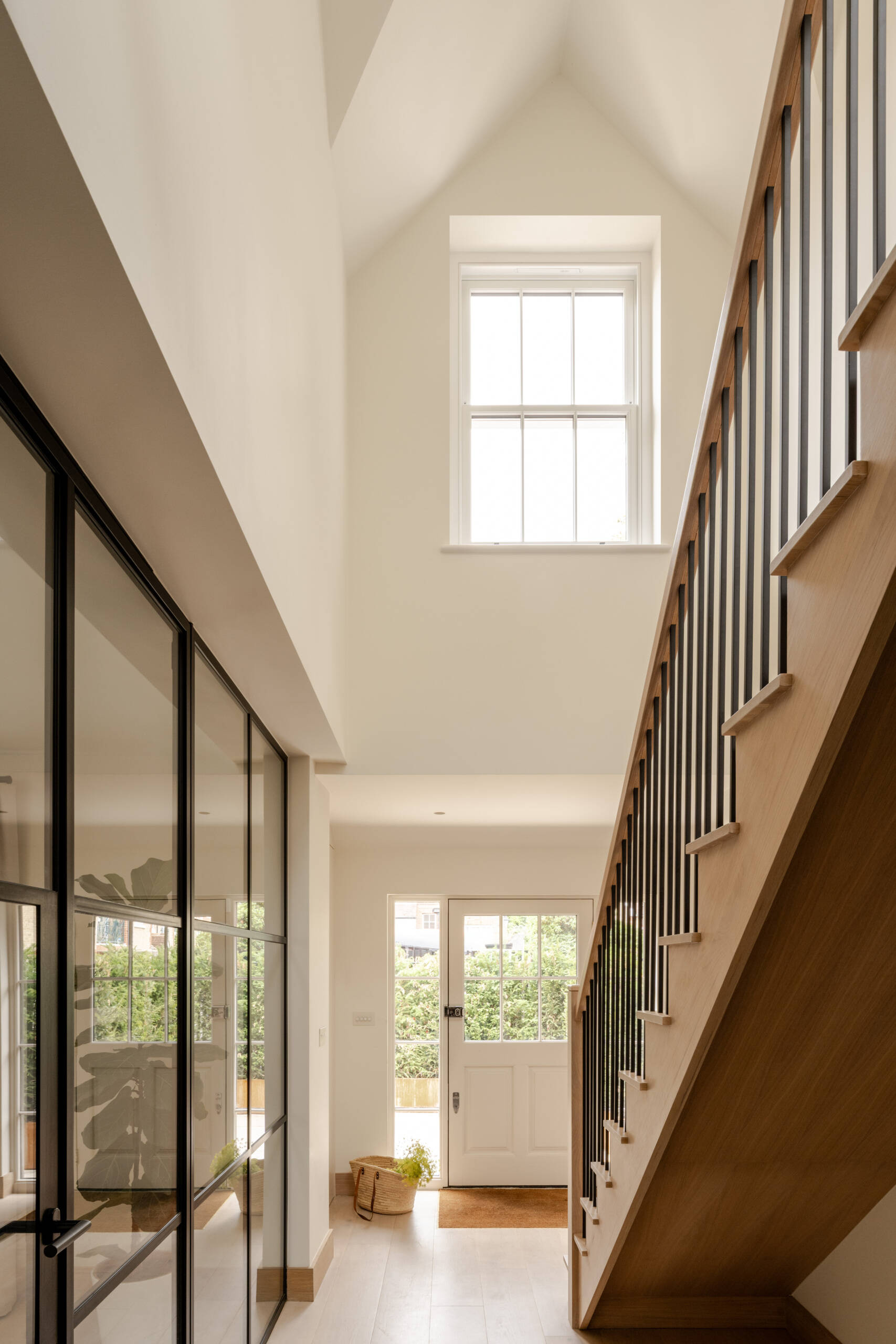 Explore the entrance and stair hall at Thirsk Cottage, where a double-height space and new dormer bring more daylight into the home's arrival sequence.