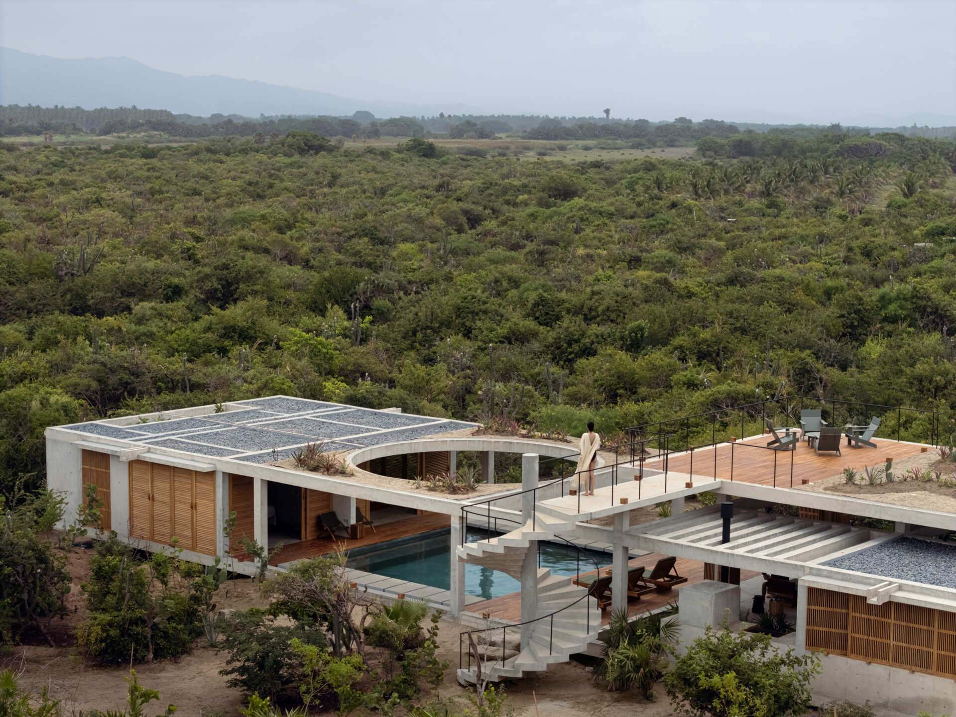 Casa Cieno by TAC Taller Alberto Calleja is a modern coastal home in Puerto Escondido, Oaxaca, organized around water, vegetation and open-air spaces.