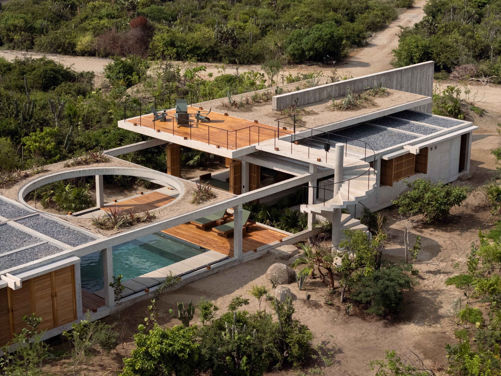 Exposed concrete and natural wood give Casa Cieno a warm, tactile interior and exterior palette designed to age naturally in the Oaxacan coastal climate.