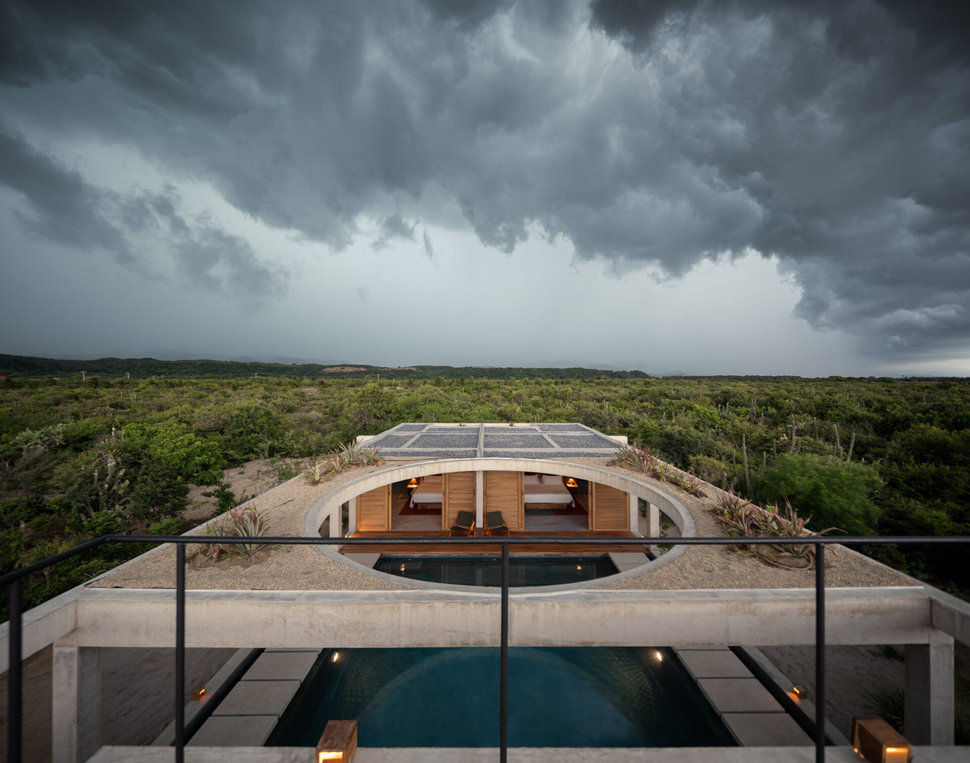 A planted rooftop extends Casa Cieno beyond its main living spaces, offering views toward the sea and Oaxacan mountains while returning greenery to the site.