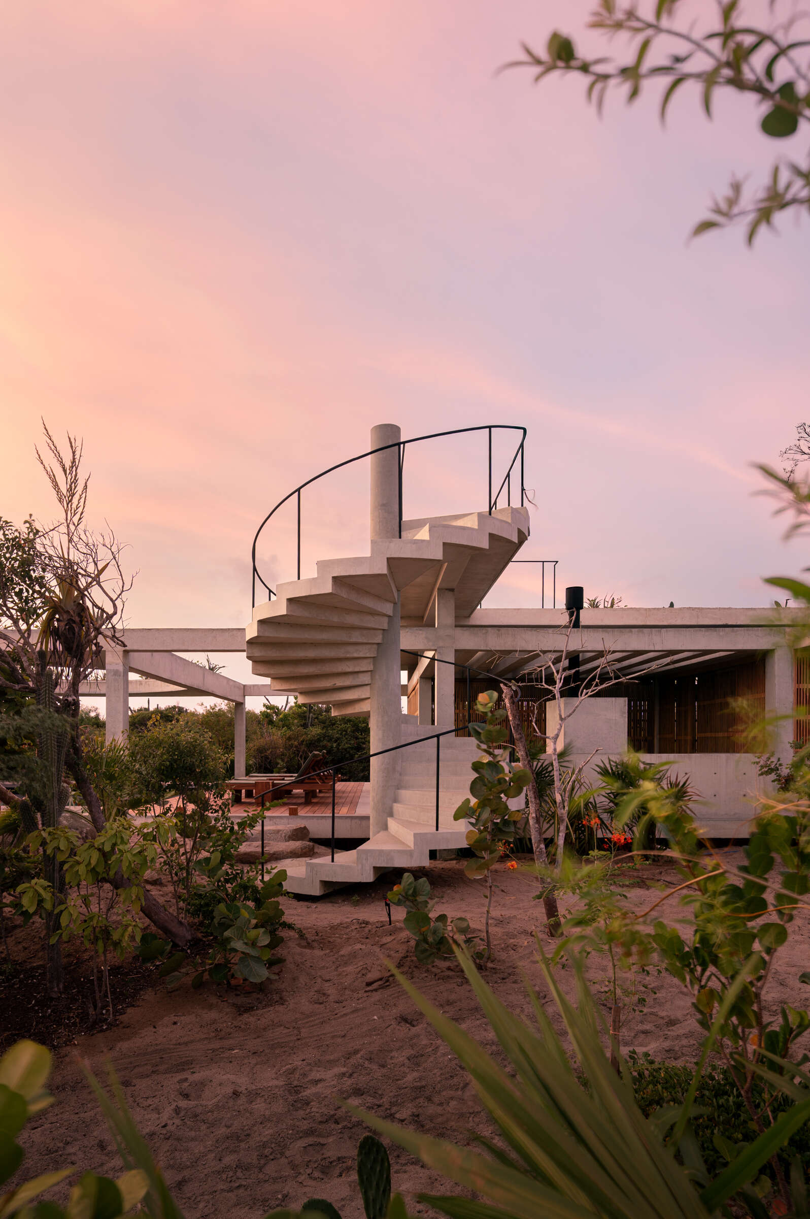 A planted rooftop extends Casa Cieno beyond its main living spaces, offering views toward the sea and Oaxacan mountains while returning greenery to the site.