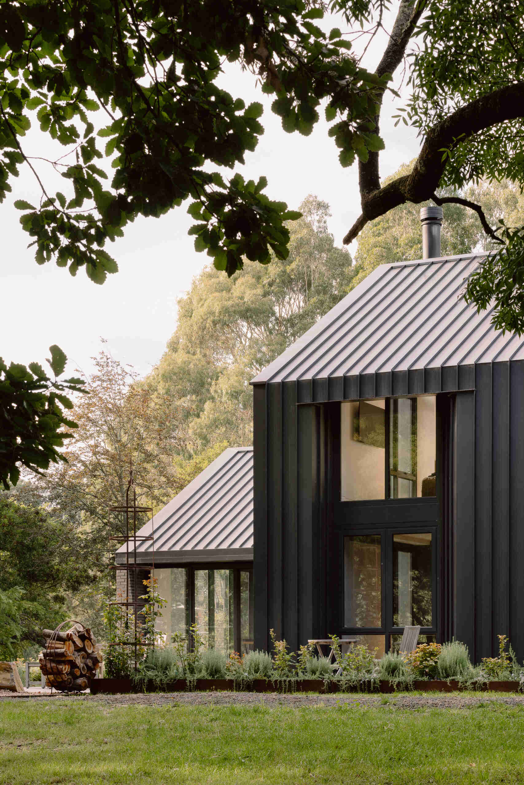 Explore the dark masonry and metal palette of Yarra Valley House, where durable exterior materials meet the practical demands of bushfire-resistant Australian architecture.