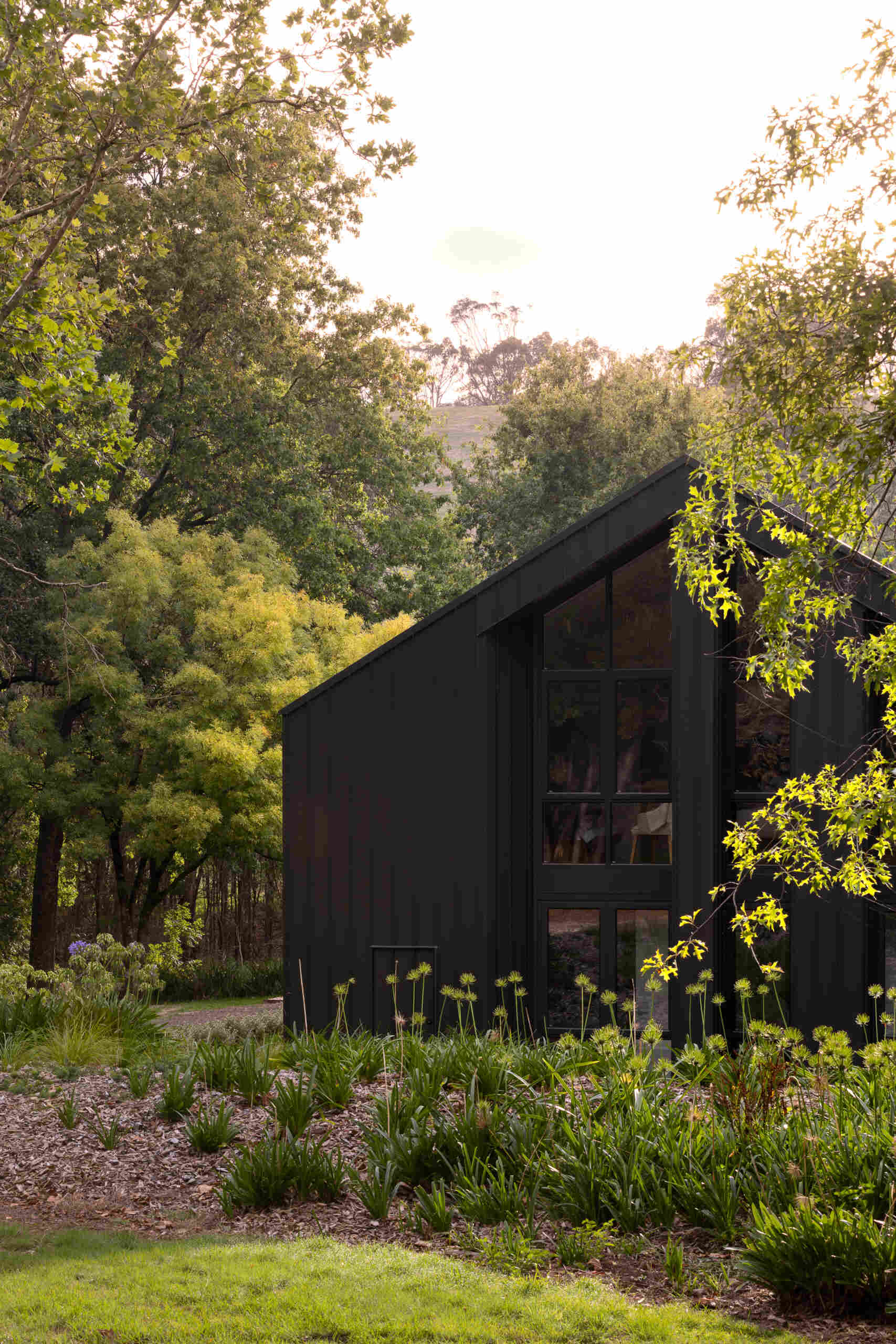 Explore the dark masonry and metal palette of Yarra Valley House, where durable exterior materials meet the practical demands of bushfire-resistant Australian architecture.