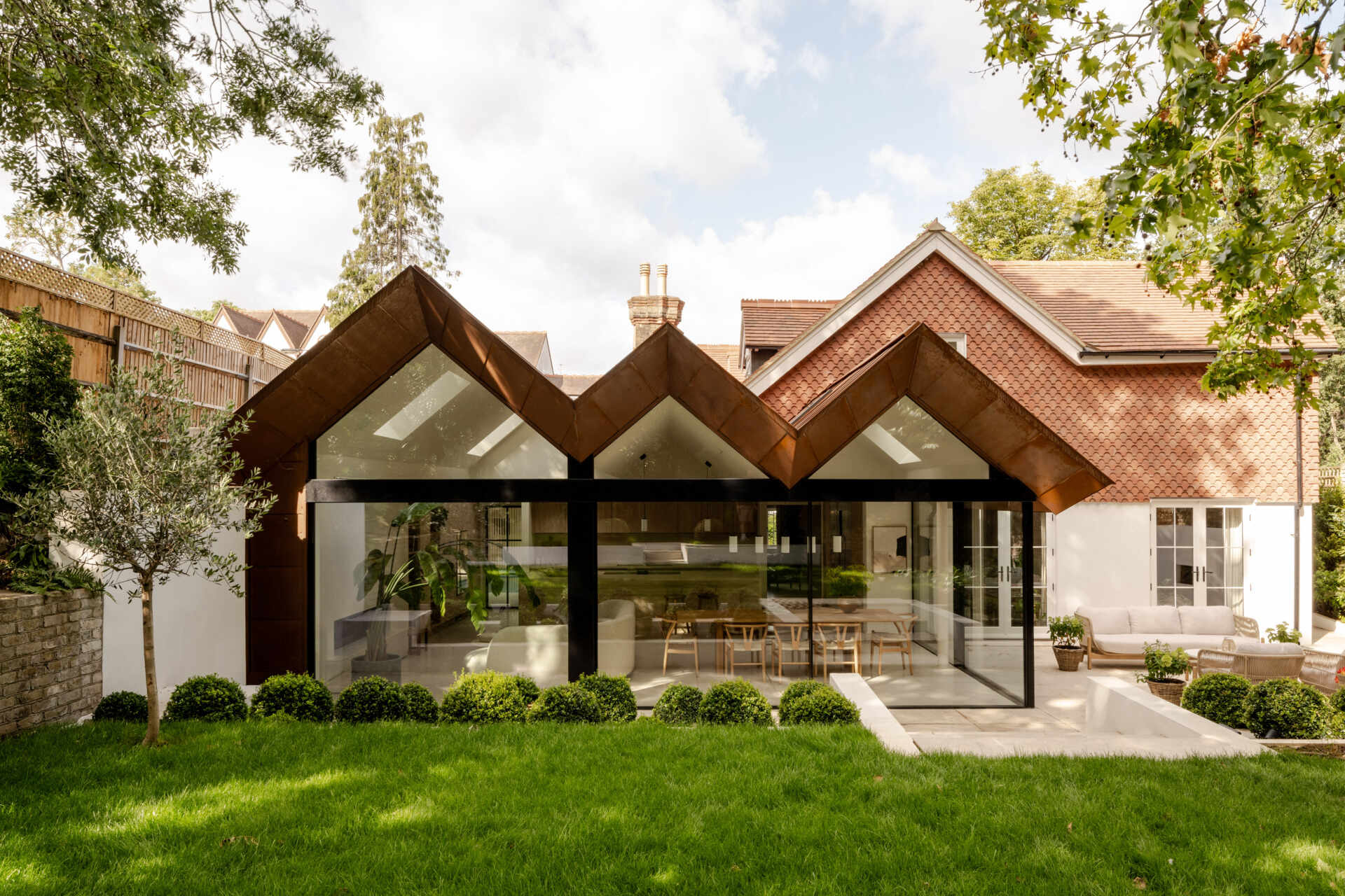Explore the architecture of Thirsk Cottage, where Finkernagel Ross drew inspiration from the home's existing pitched roofs to create a contemporary folded roof extension.