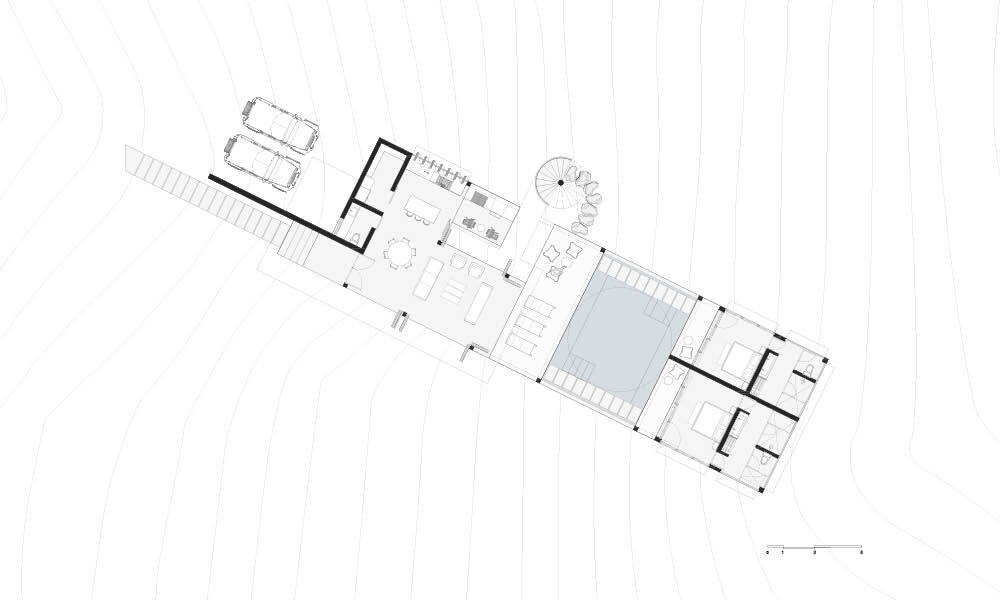 The Casa Cieno floor plan places the central pool between the social and private areas, with the two bedrooms reached by paths crossing over the water.